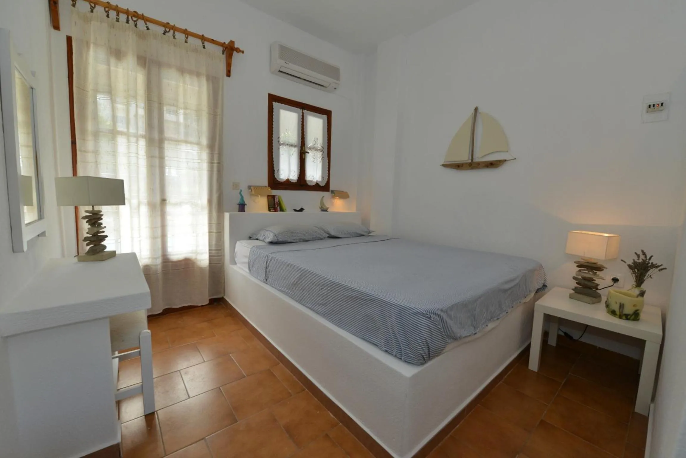 Bed in Anofli Suites