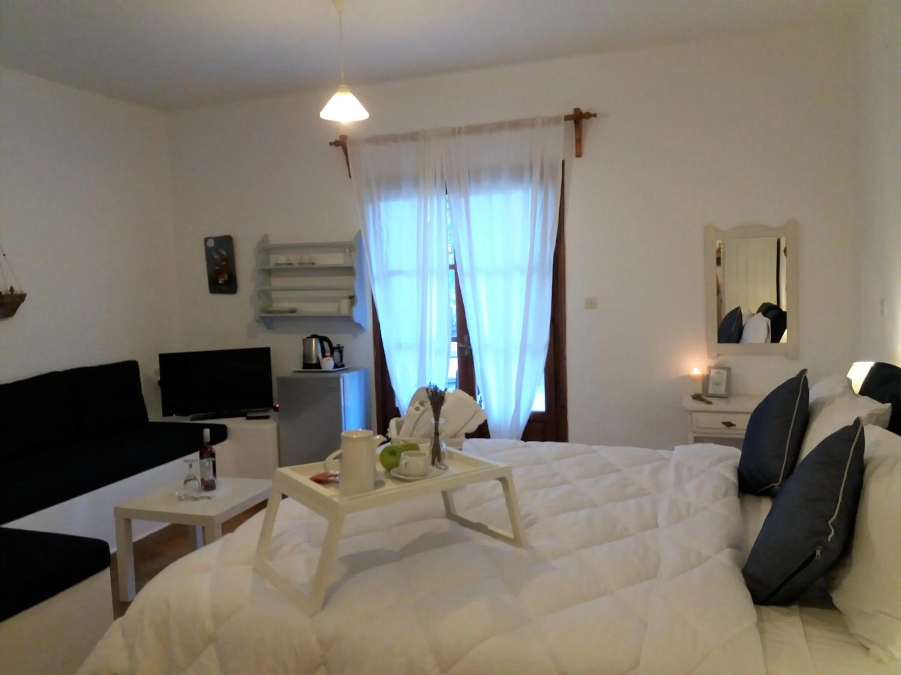 Bed in Anofli Suites