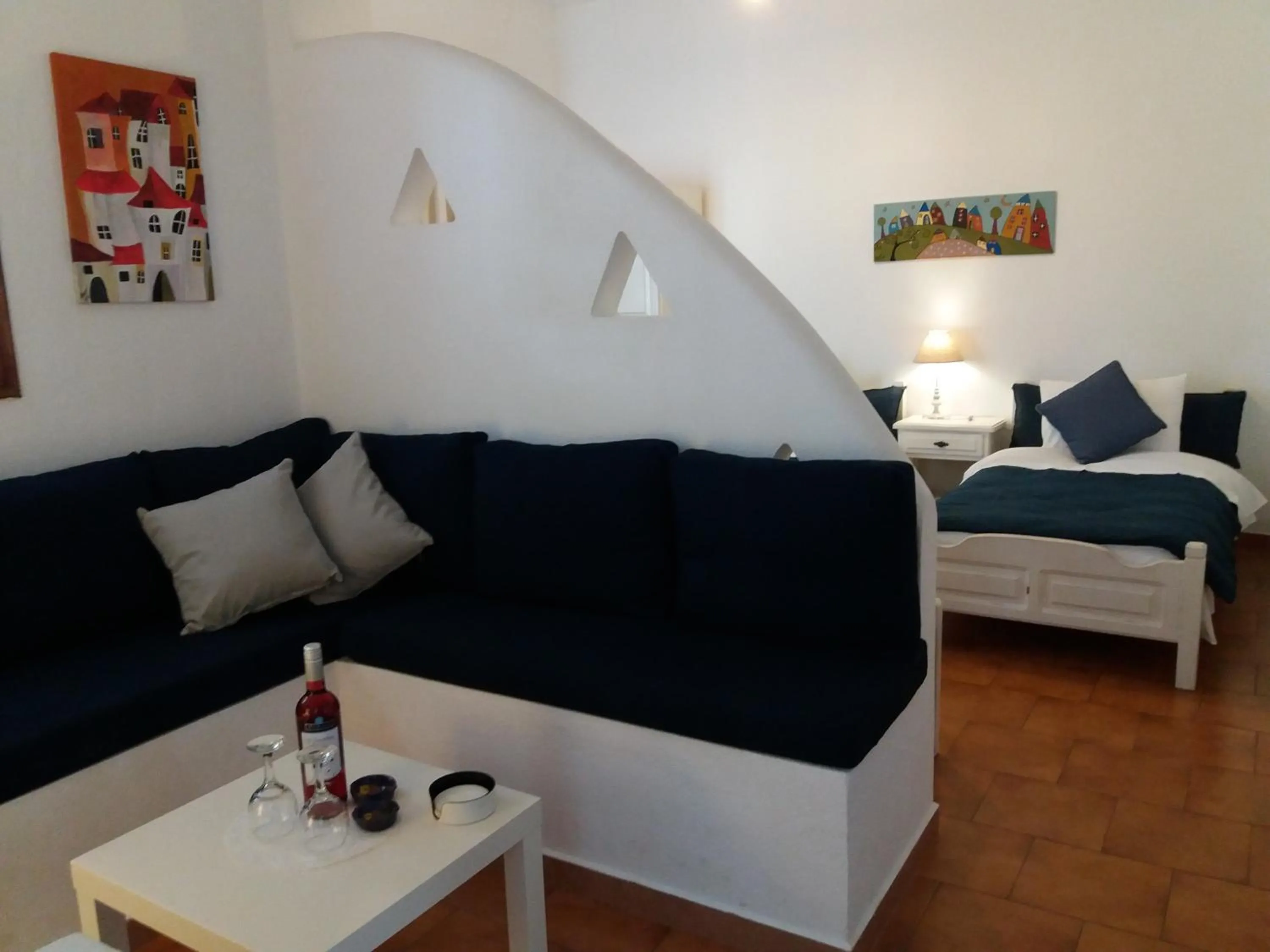 Seating area, Bed in Anofli Suites