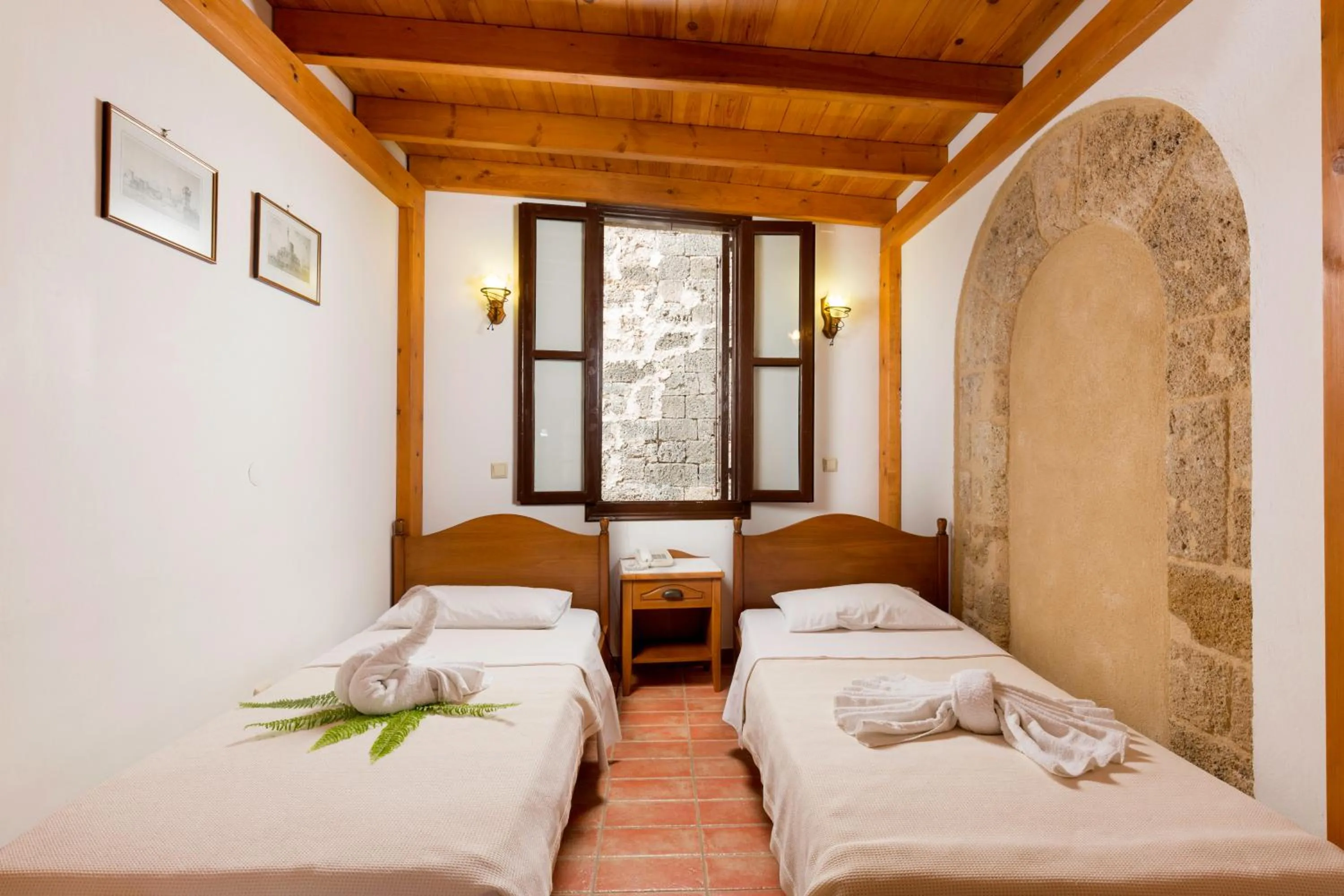 Bed in Camelot Traditional & Classic Hotel