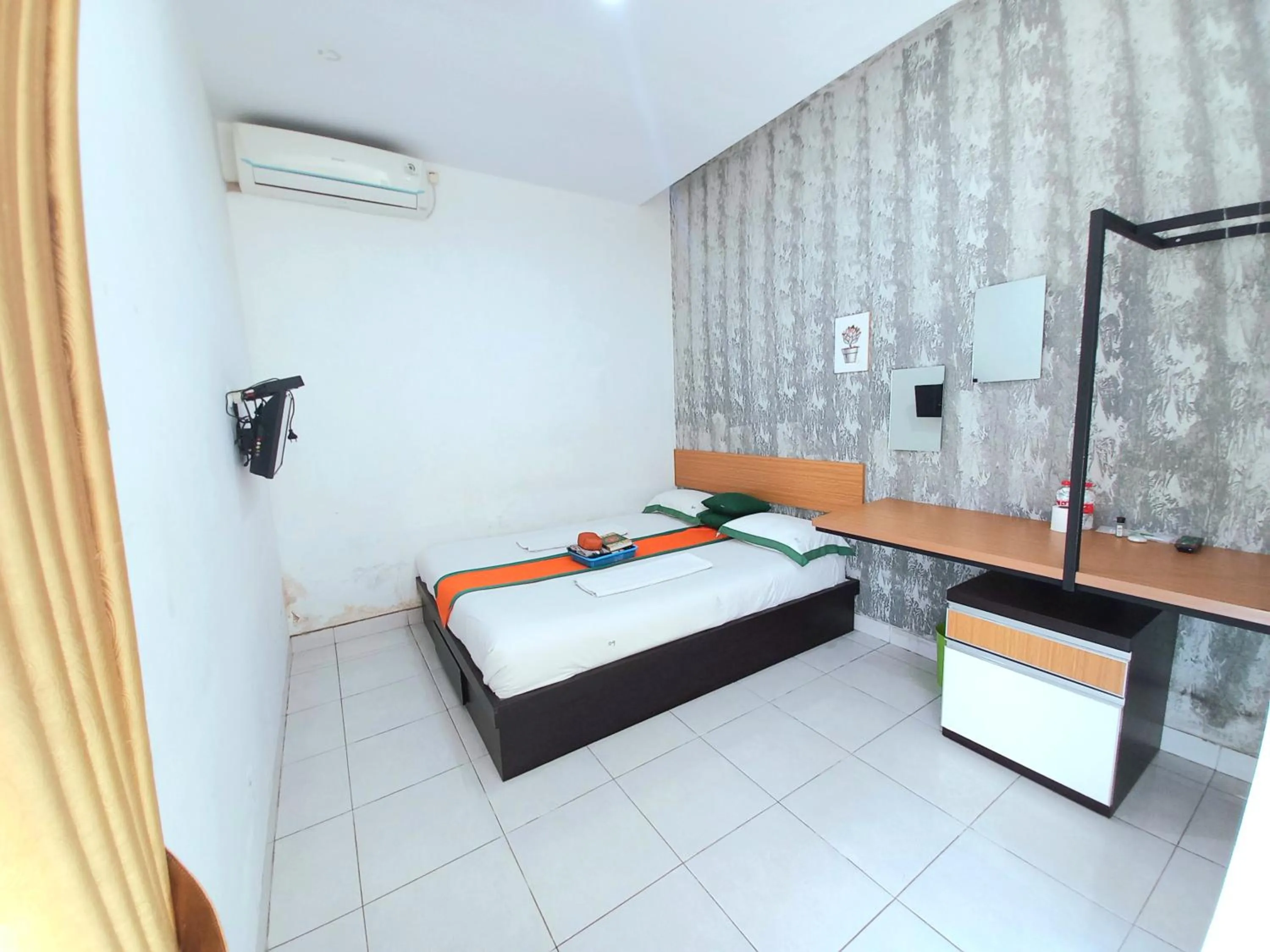 Bed in Hotel Jogja Kili Suci By Simply Homy