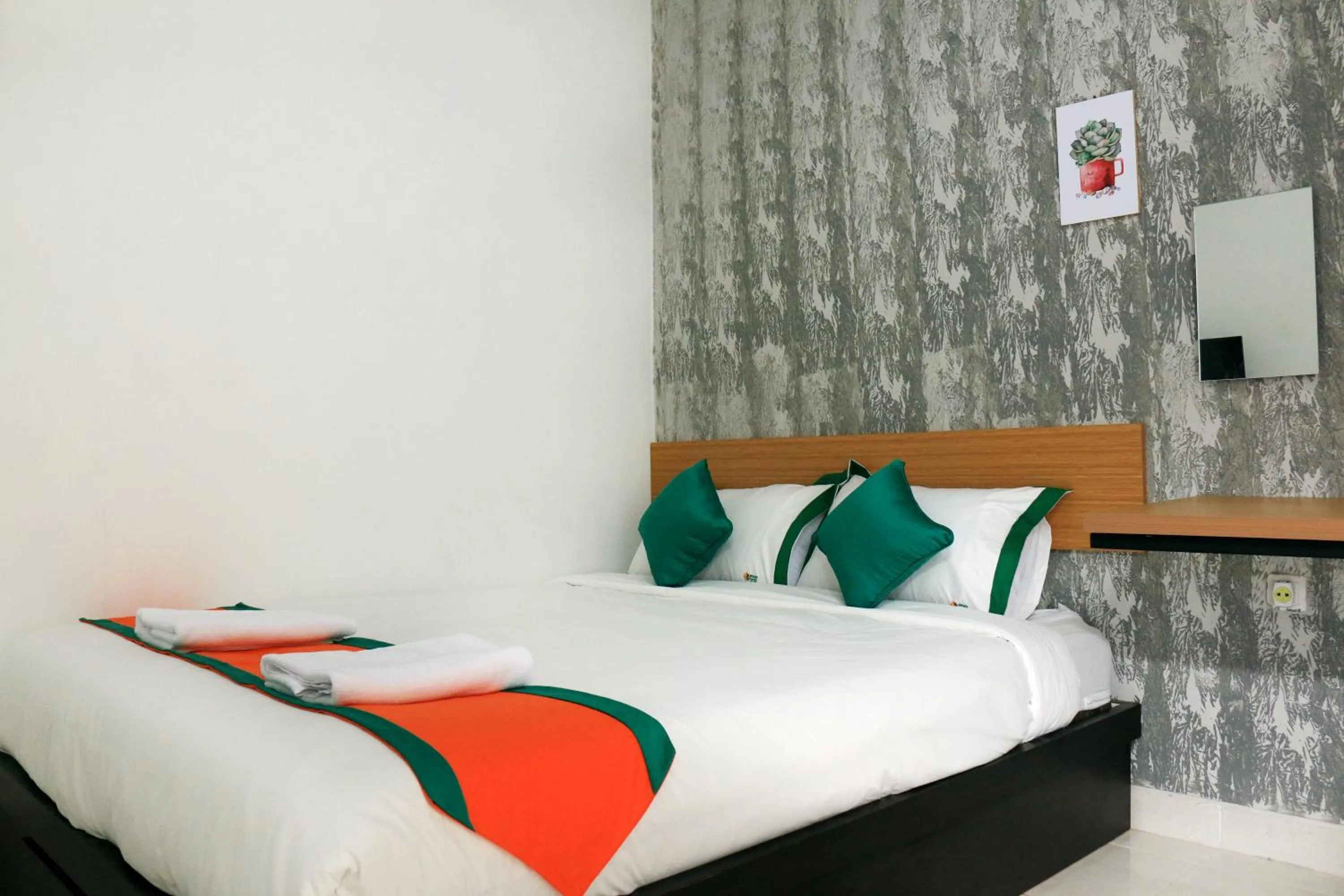 Bed in Hotel Jogja Kili Suci By Simply Homy