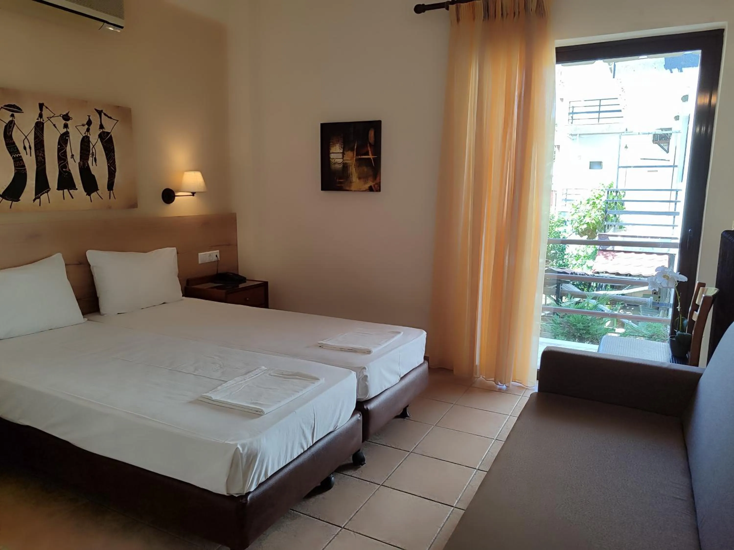 Bed in Hotel Prigipikon Suites and sofites