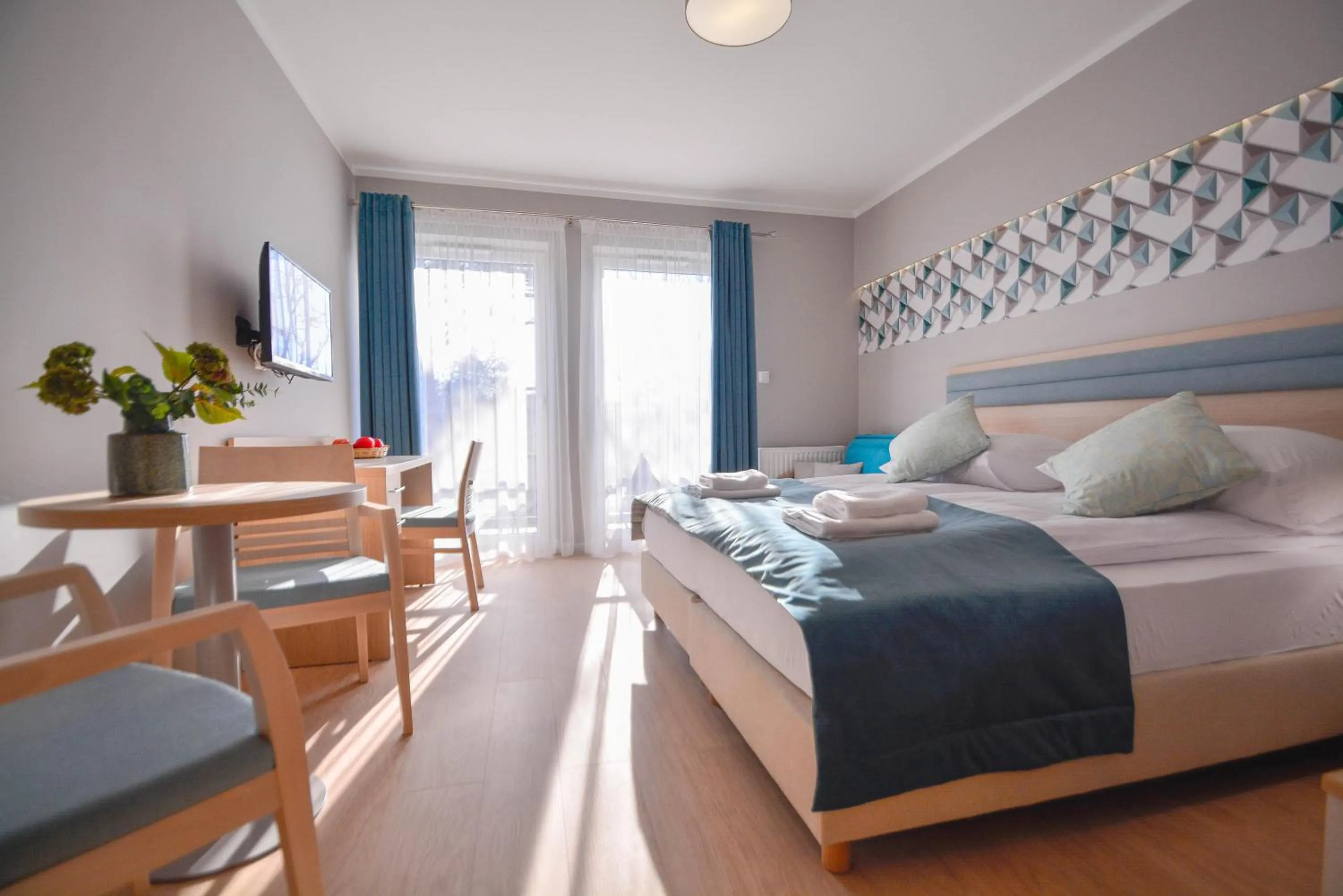 Seating area, Bed in Osiedle Cesarskie Apartamenty - Parking - Apartamenty Bryza