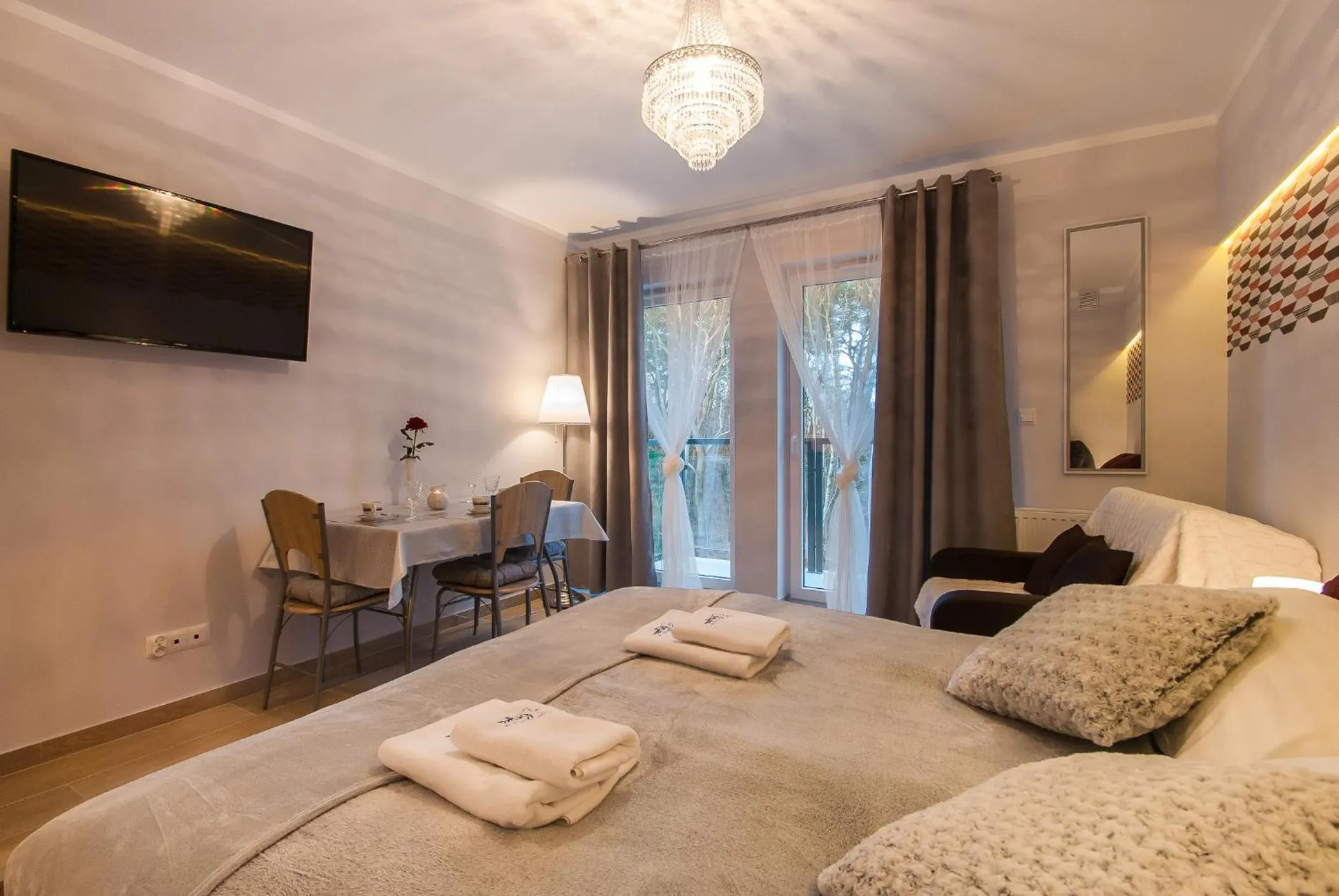 Seating area, Bed in Osiedle Cesarskie Apartamenty - Parking - Apartamenty Bryza