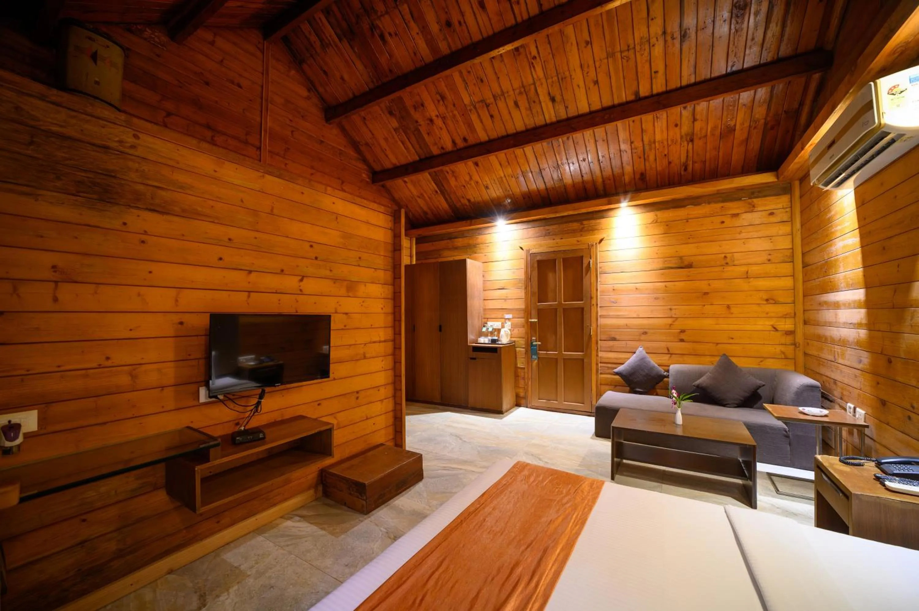 Seating area, Bed in Sinclairs Retreat Dooars, Chalsa