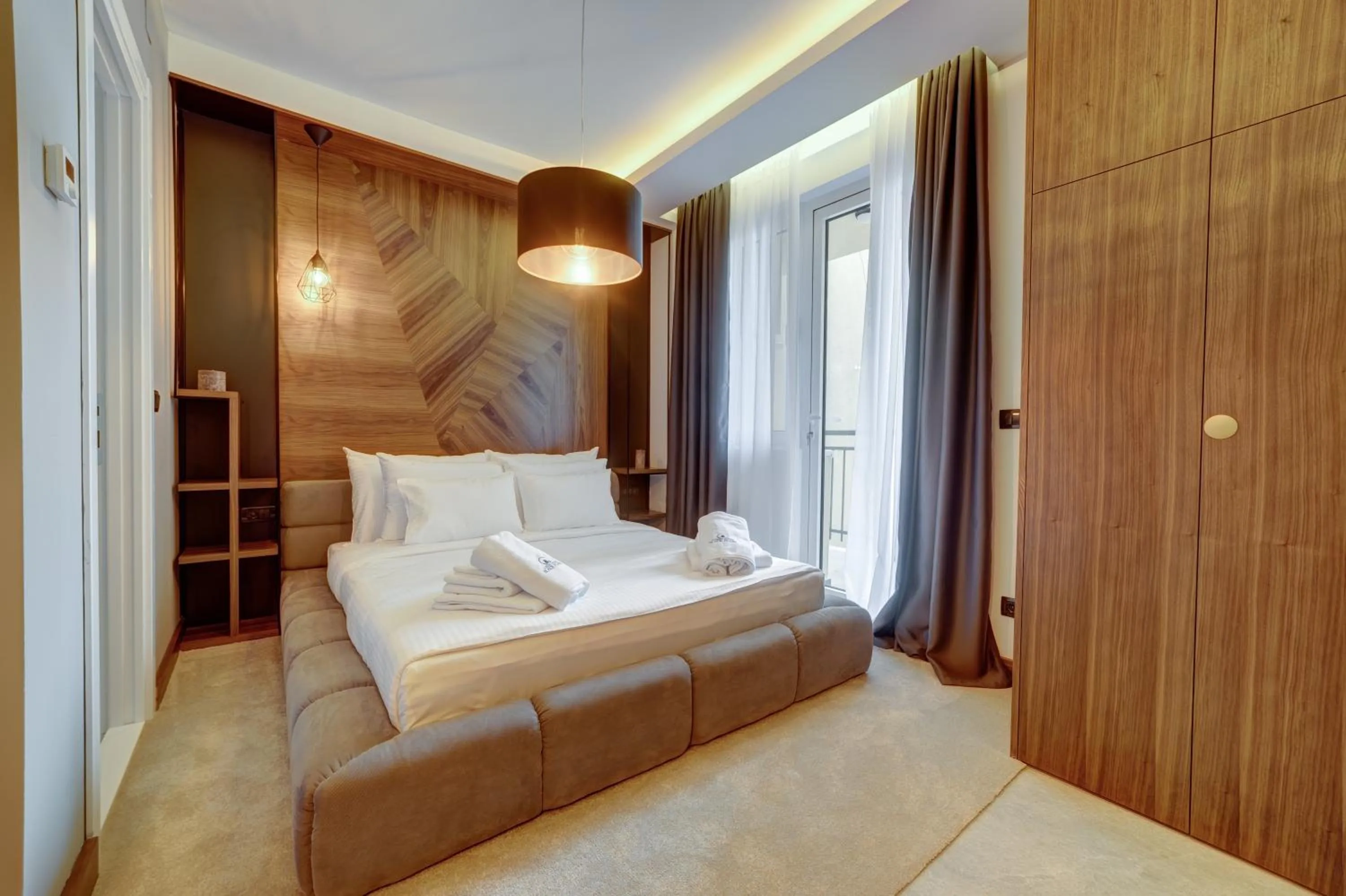 Bed in Black Pearl Luxury Suites