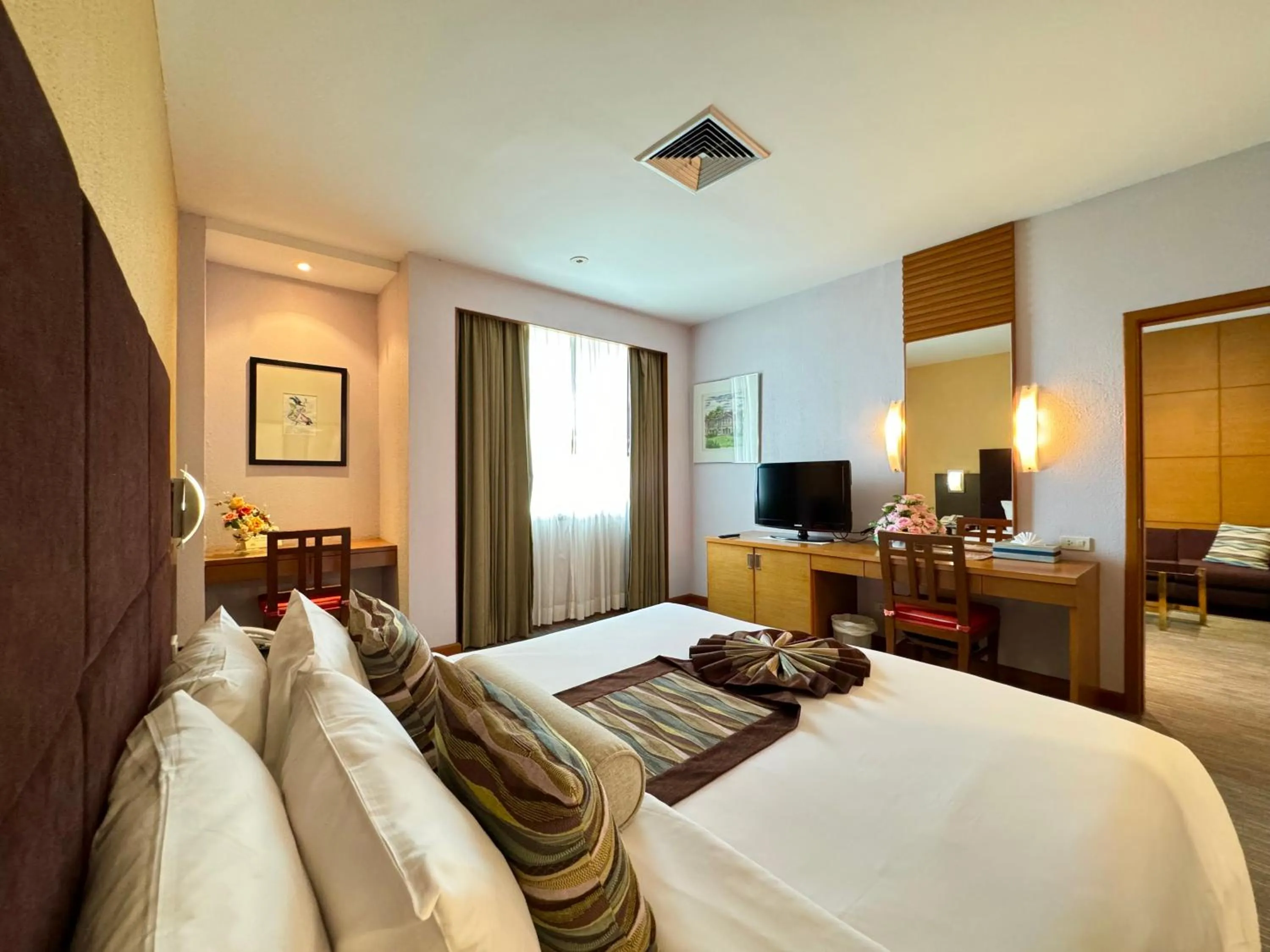 Bed in Phuket Merlin Hotel