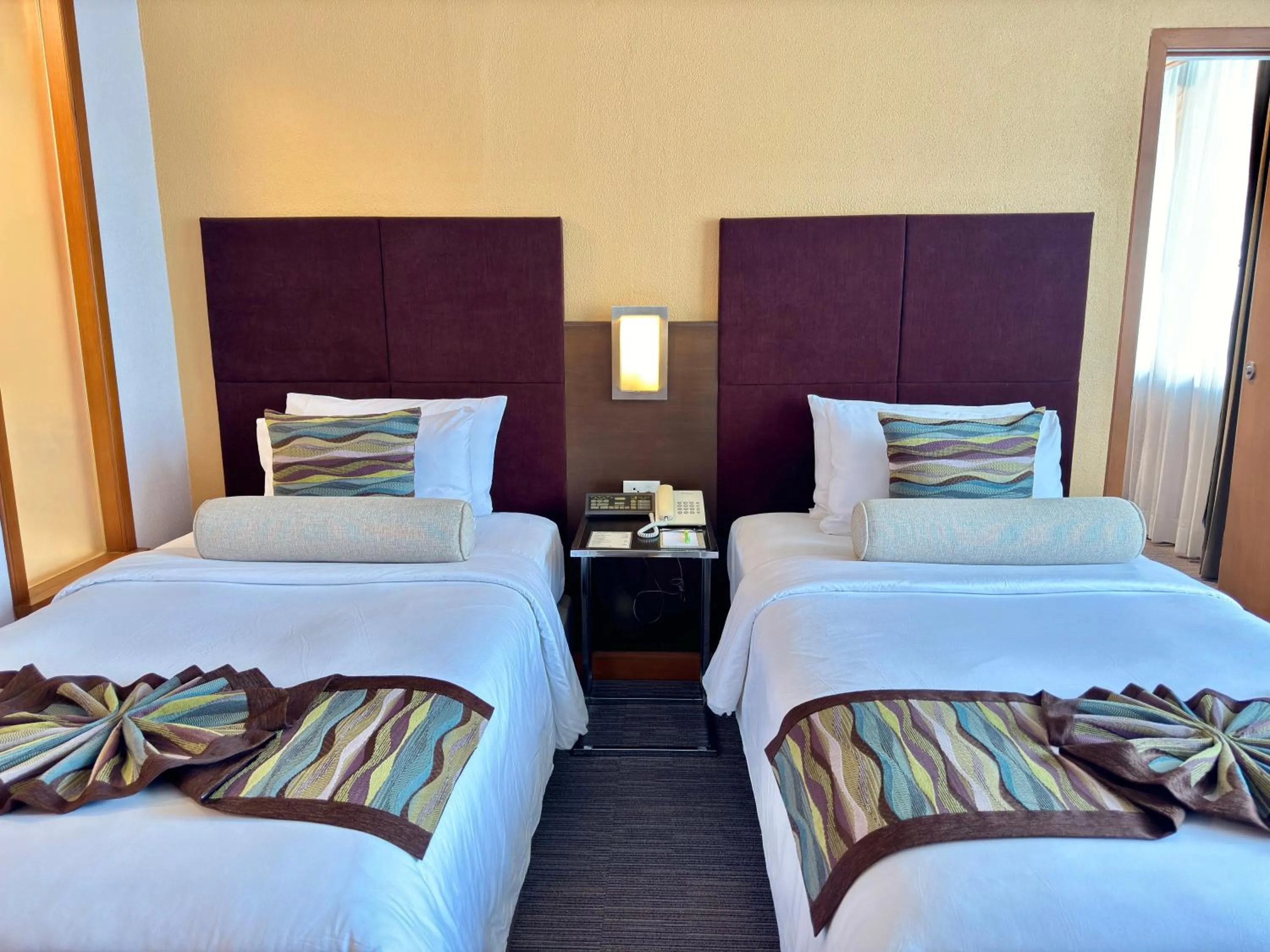 Bedroom, Bed in Phuket Merlin Hotel