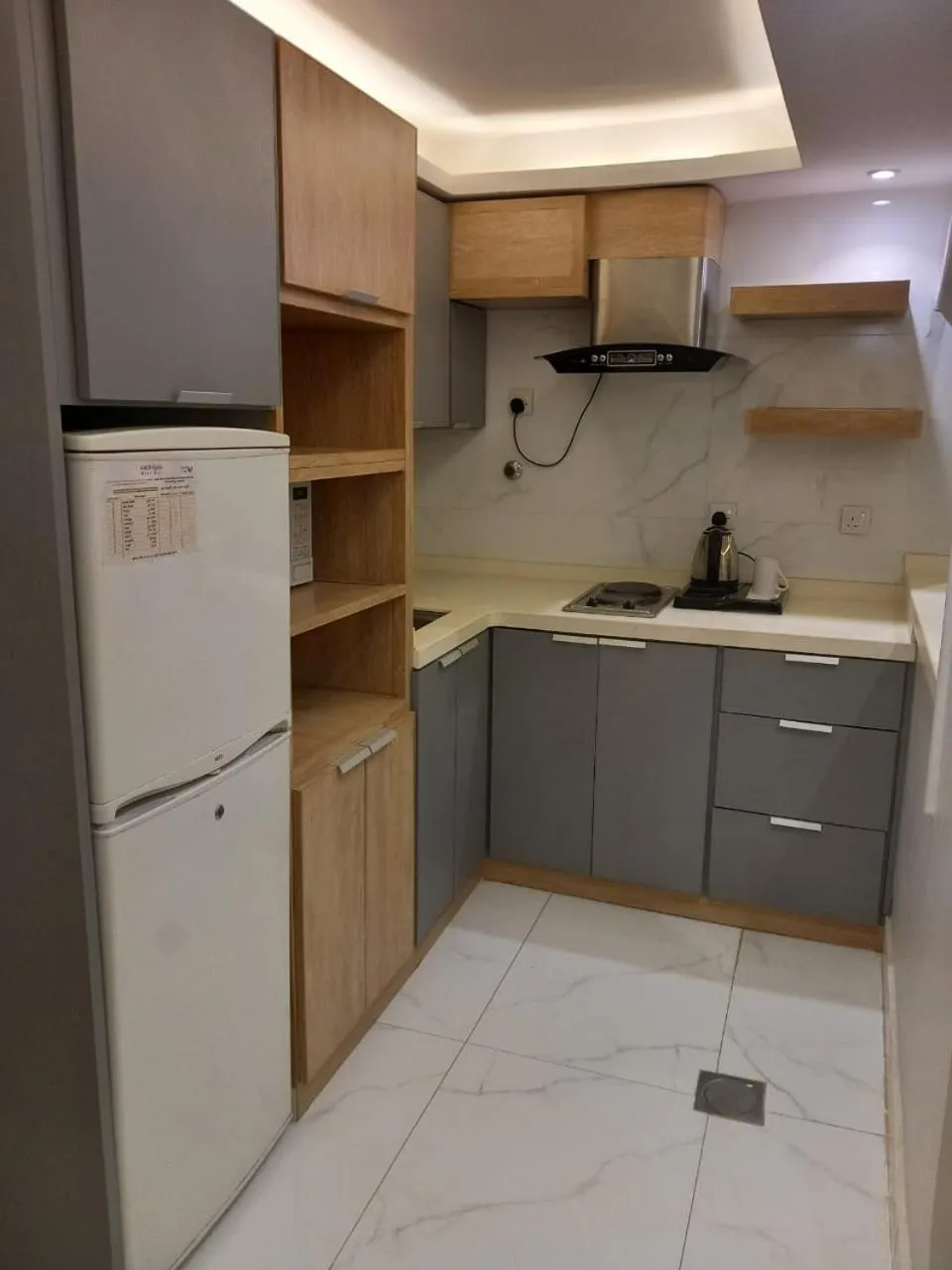 Kitchen or kitchenette in فيجن للشقق المخدومة ــ اقتصادي