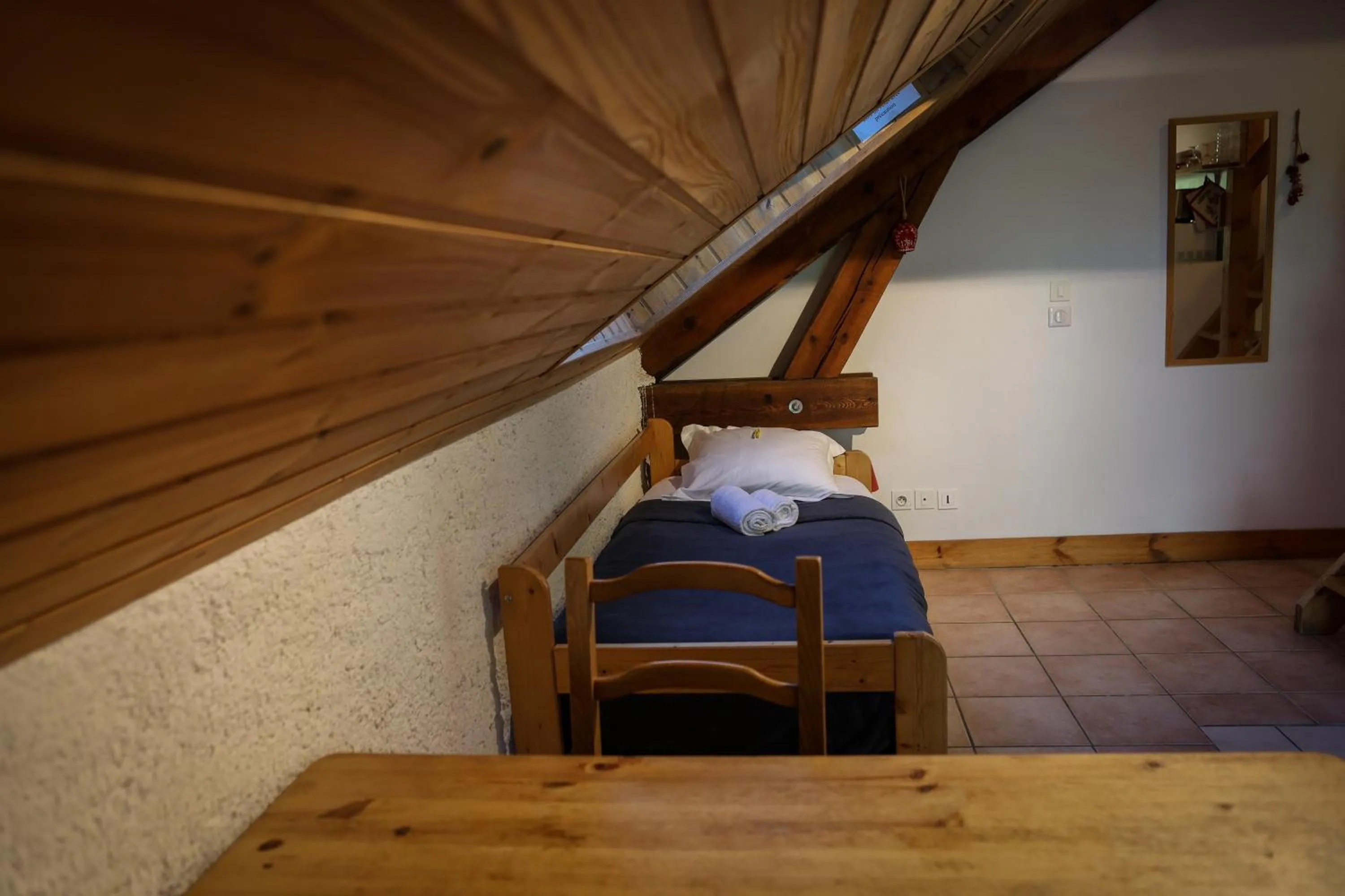 Bed in Hôtel Restaurant Gîtes Les 5 Saisons