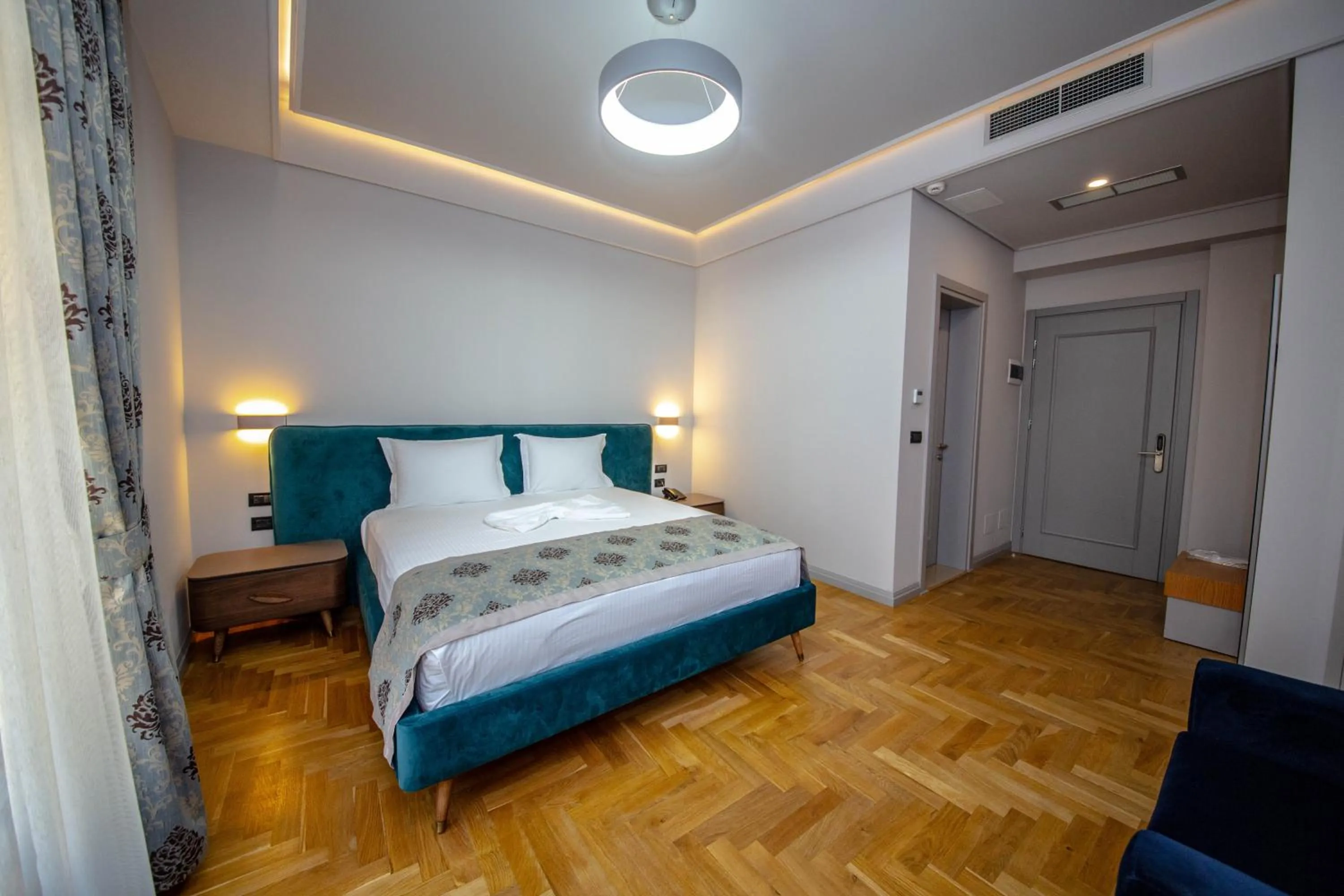 Photo of the whole room, Bed in City Center Hotel