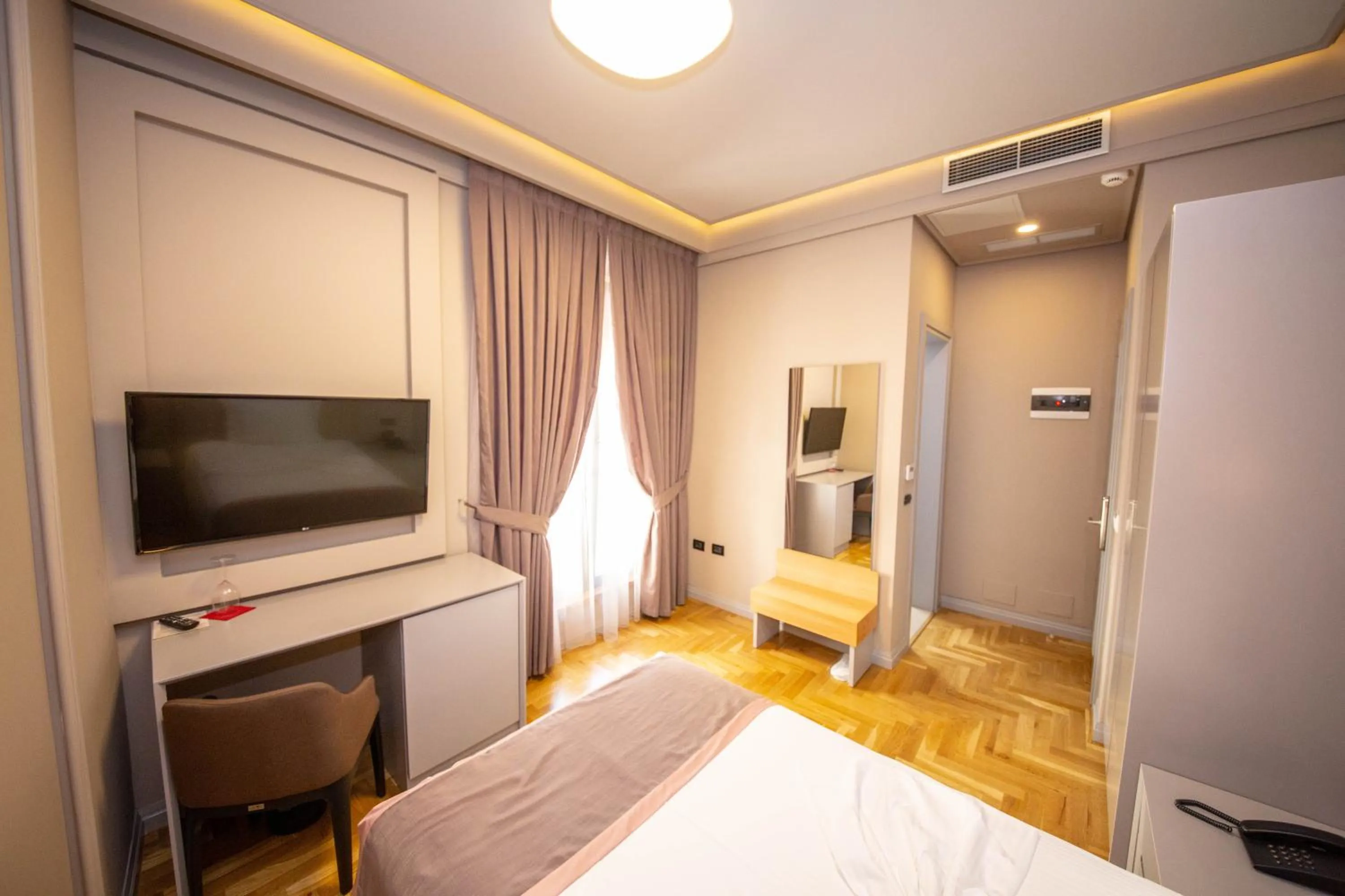 Photo of the whole room, Bed in City Center Hotel