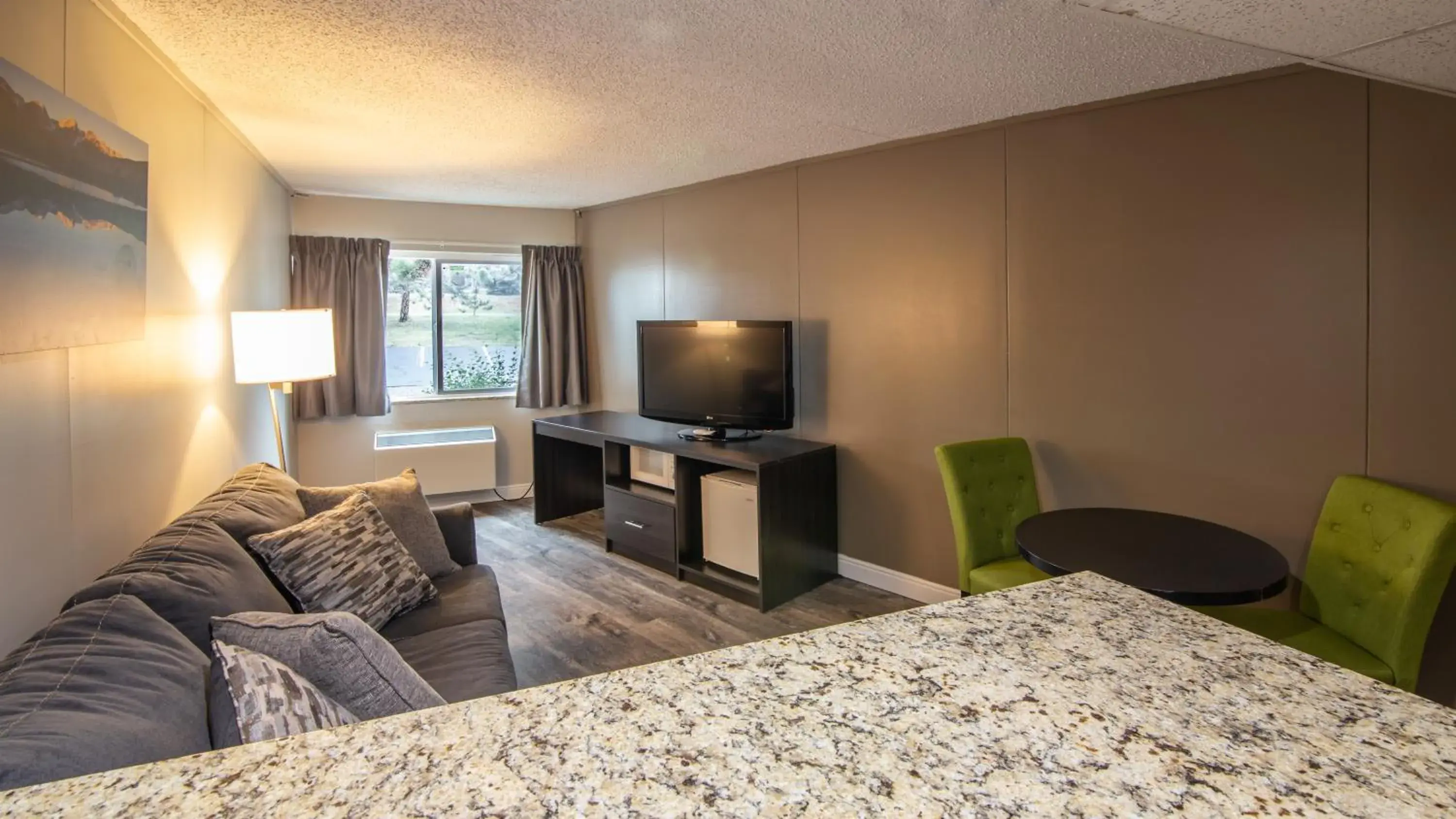 Living room, TV/Entertainment Center in Rocky Mountain Hotel & Conference Center Living room, TV/Entertainment Center in Rocky Mountain Hotel & Conference Center