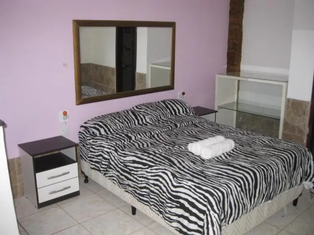 Bed in Pousada Ferradura Beach