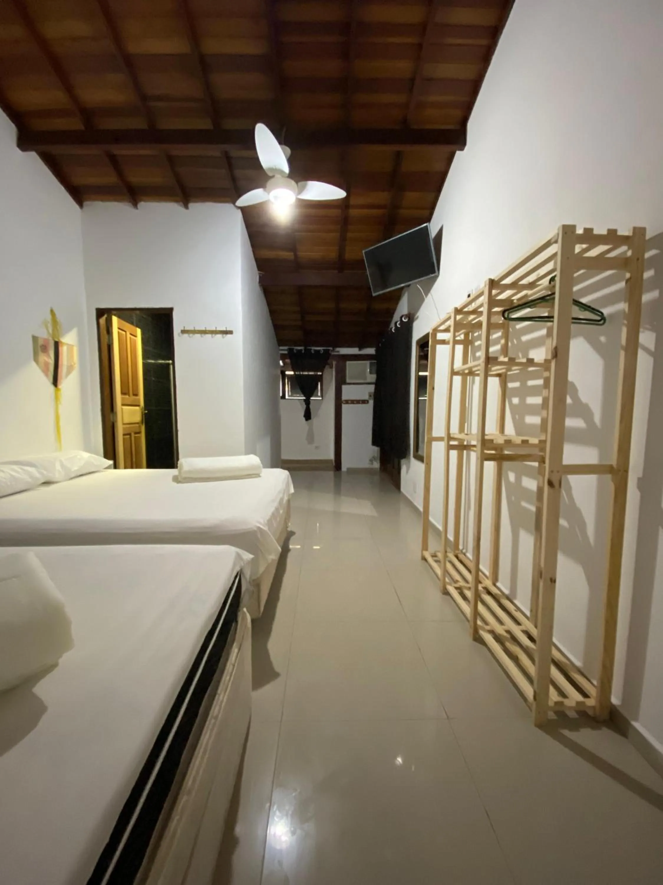 Bed in Pousada Ferradura Beach