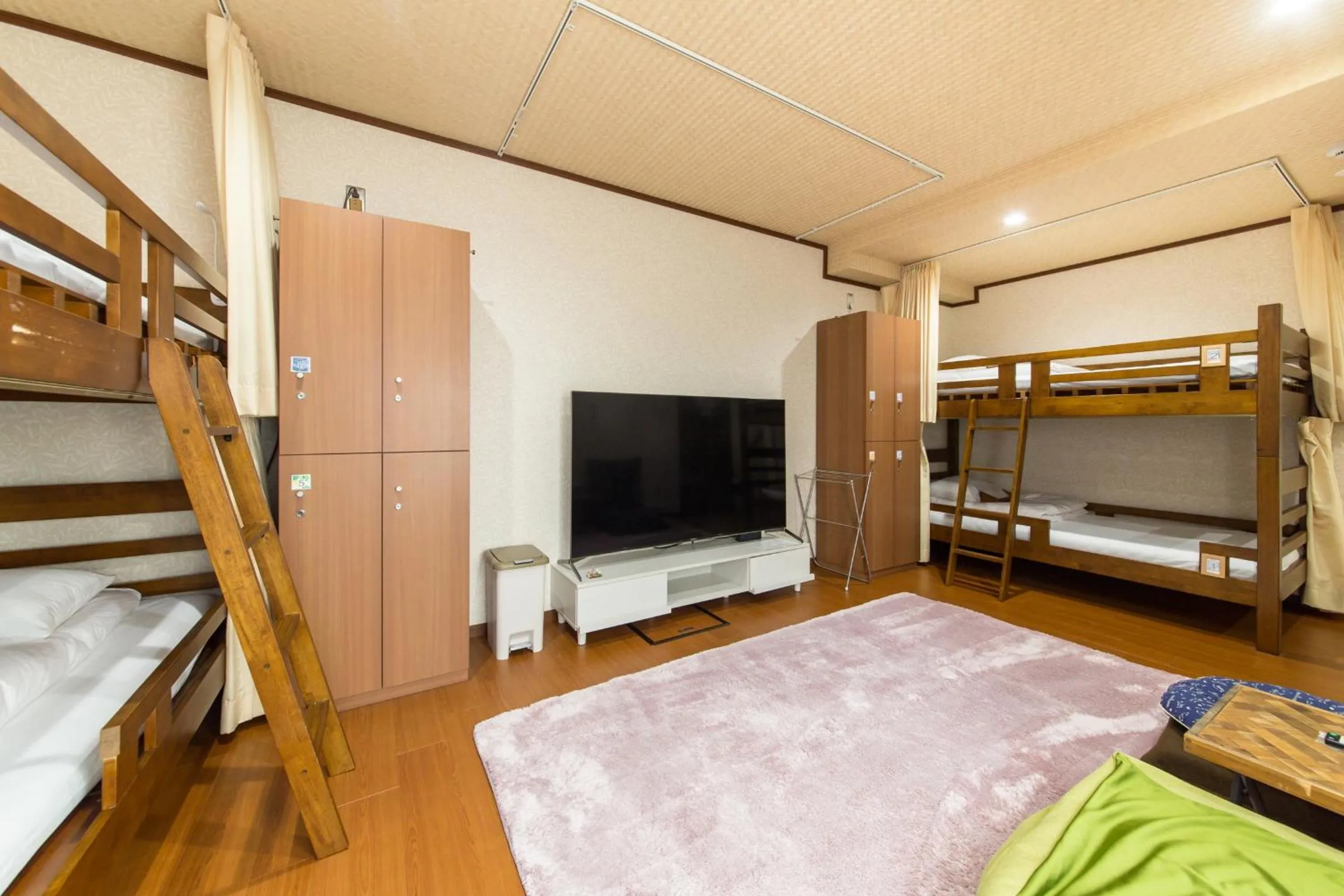 Communal lounge/ TV room, Bed in Woman Only Guesthouse Nanohana (Female only)