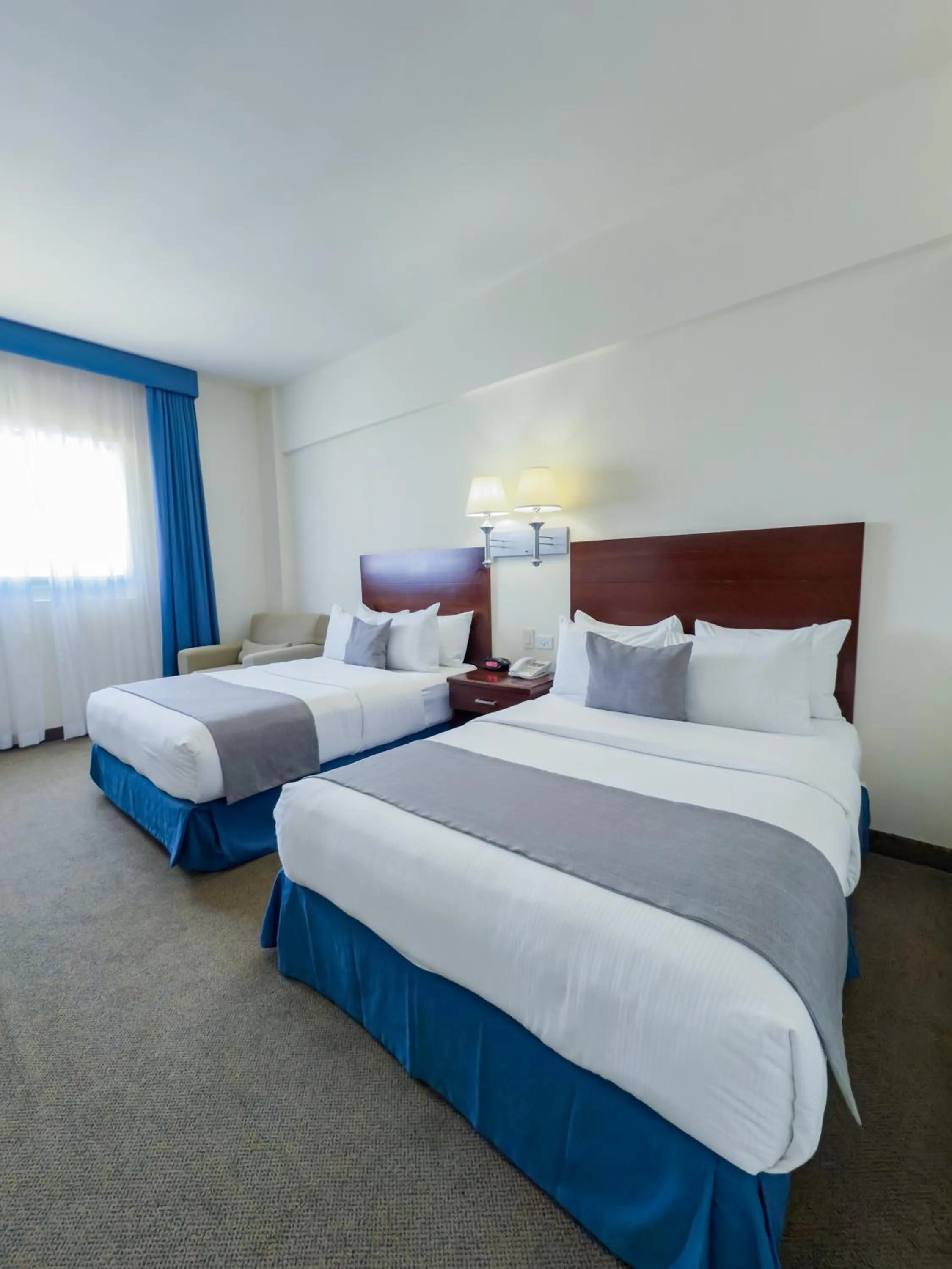 Bed in Hotel Aeropuerto Los Cabos