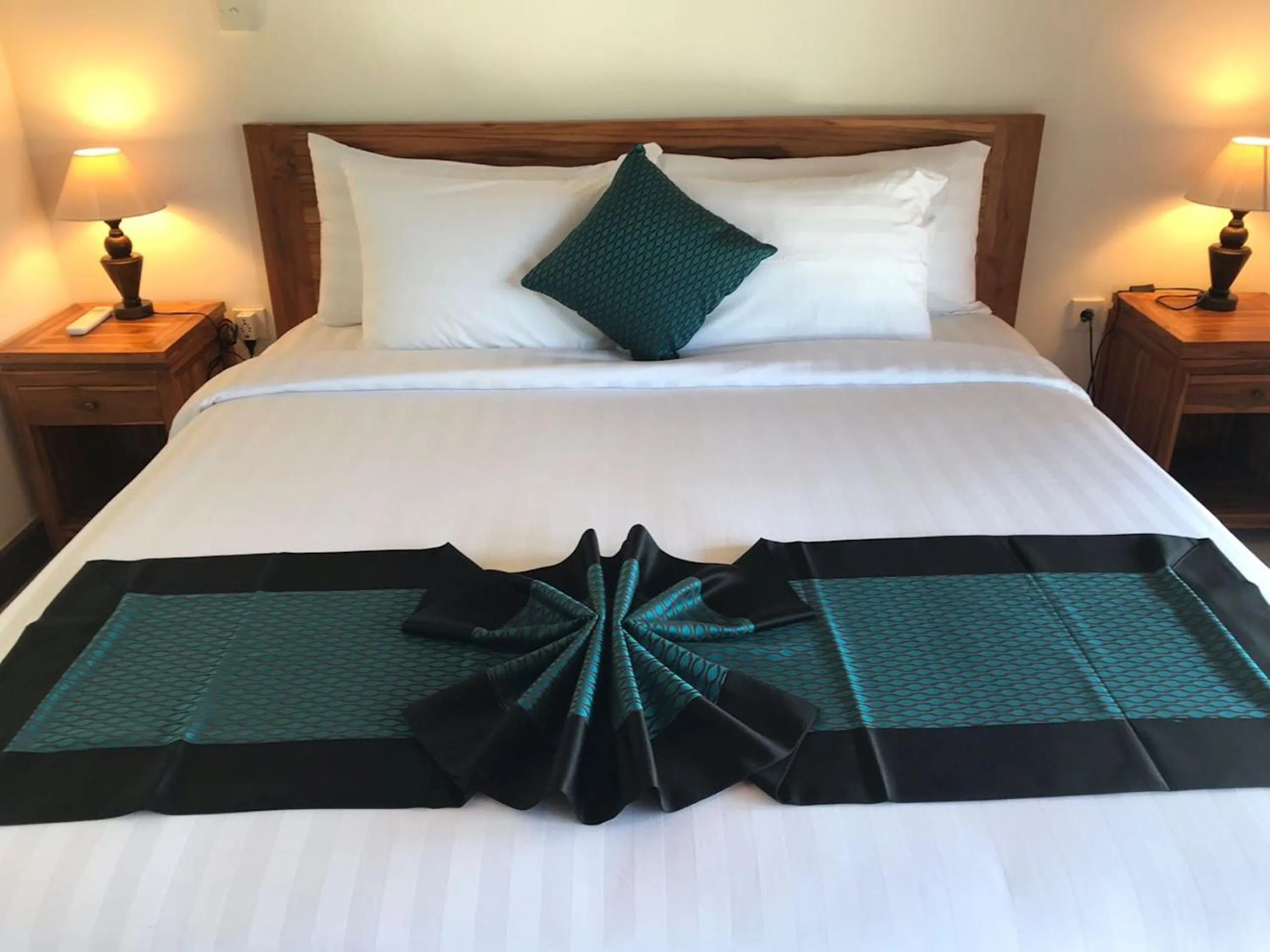 Bed in Paraiso Cottage Ubud