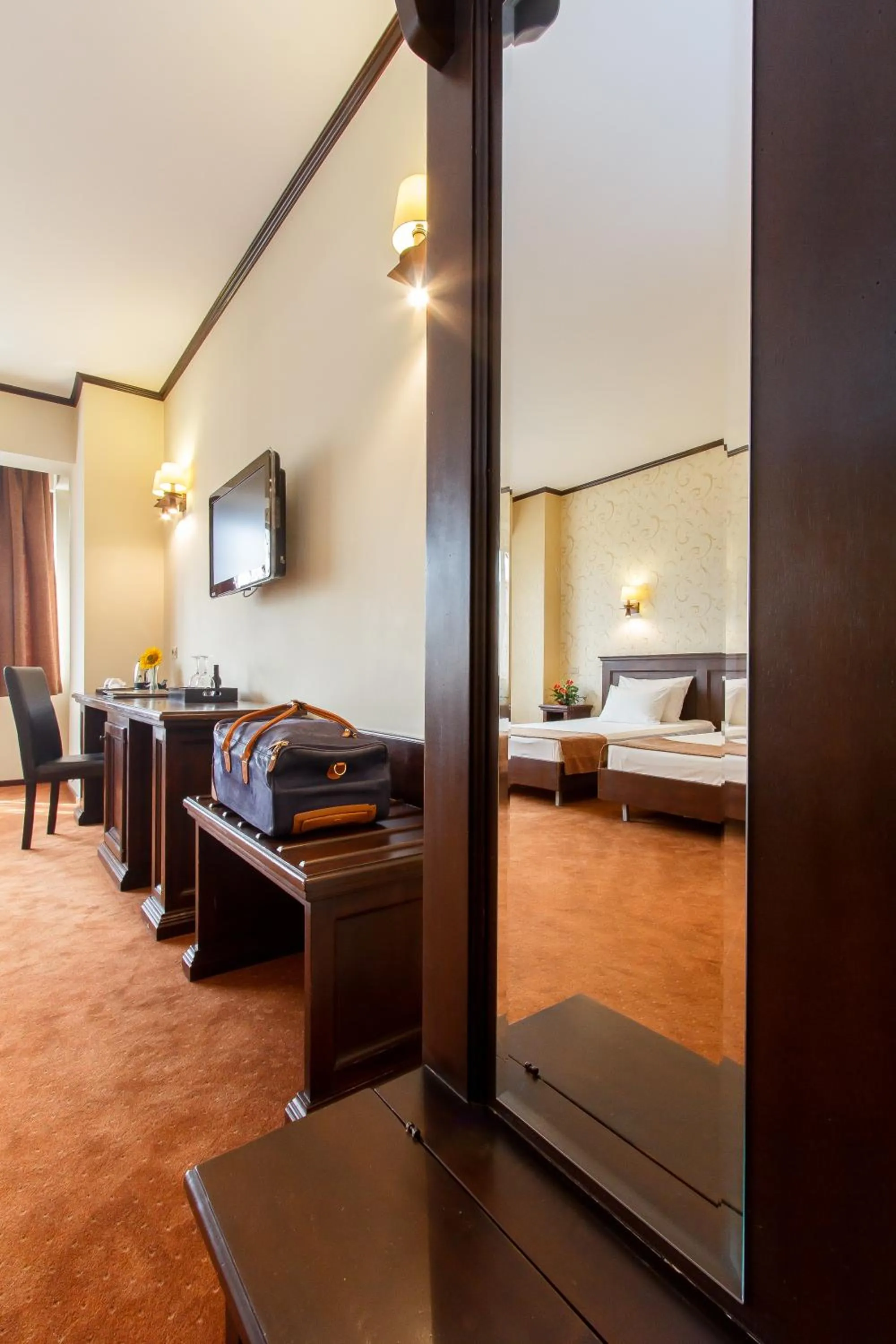 Living room, Bed in International Bucharest City Centre Hotel