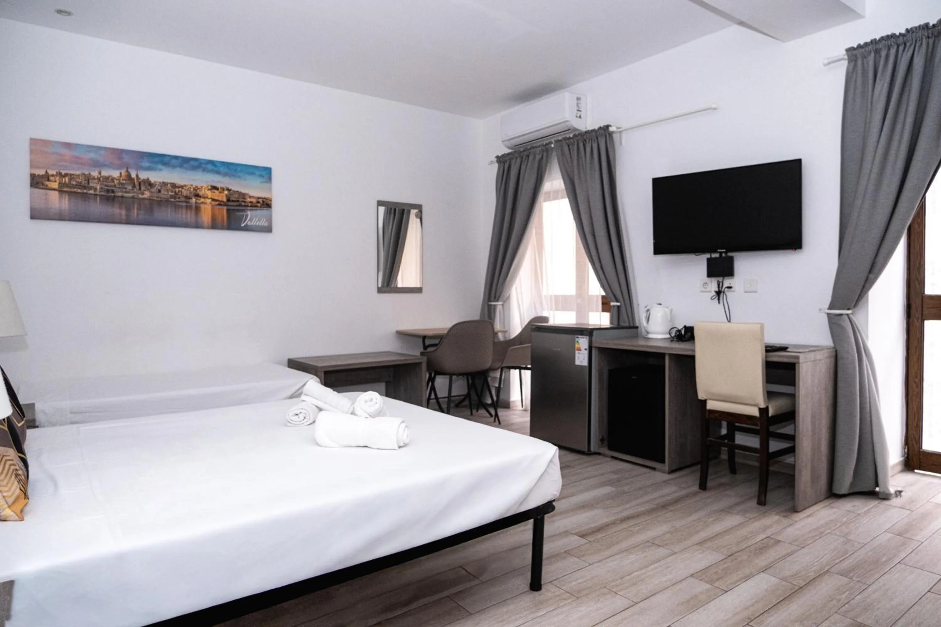 Bed in Napoli Suites Studios Aparthotel