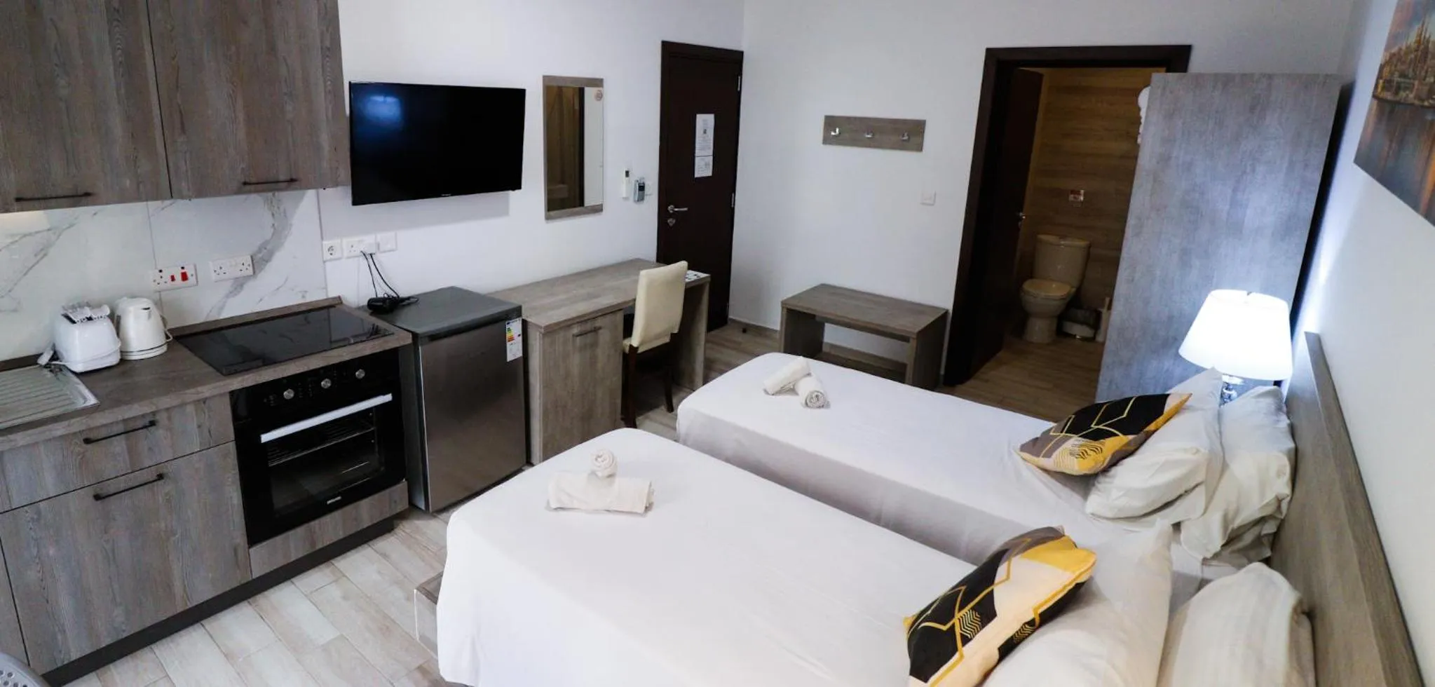 Bed in Napoli Suites Studios Aparthotel