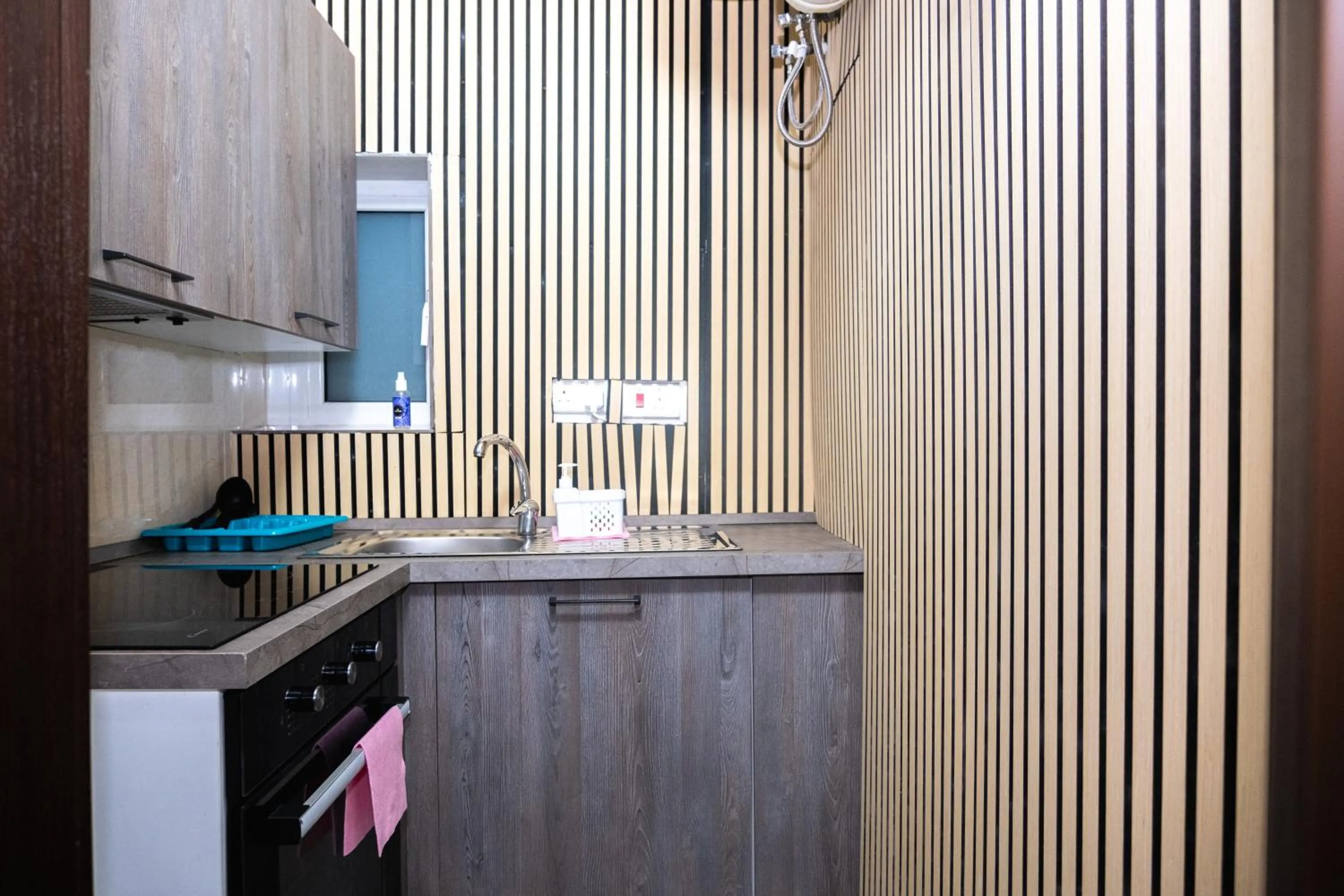 Kitchen or kitchenette in Napoli Suites Studios Aparthotel