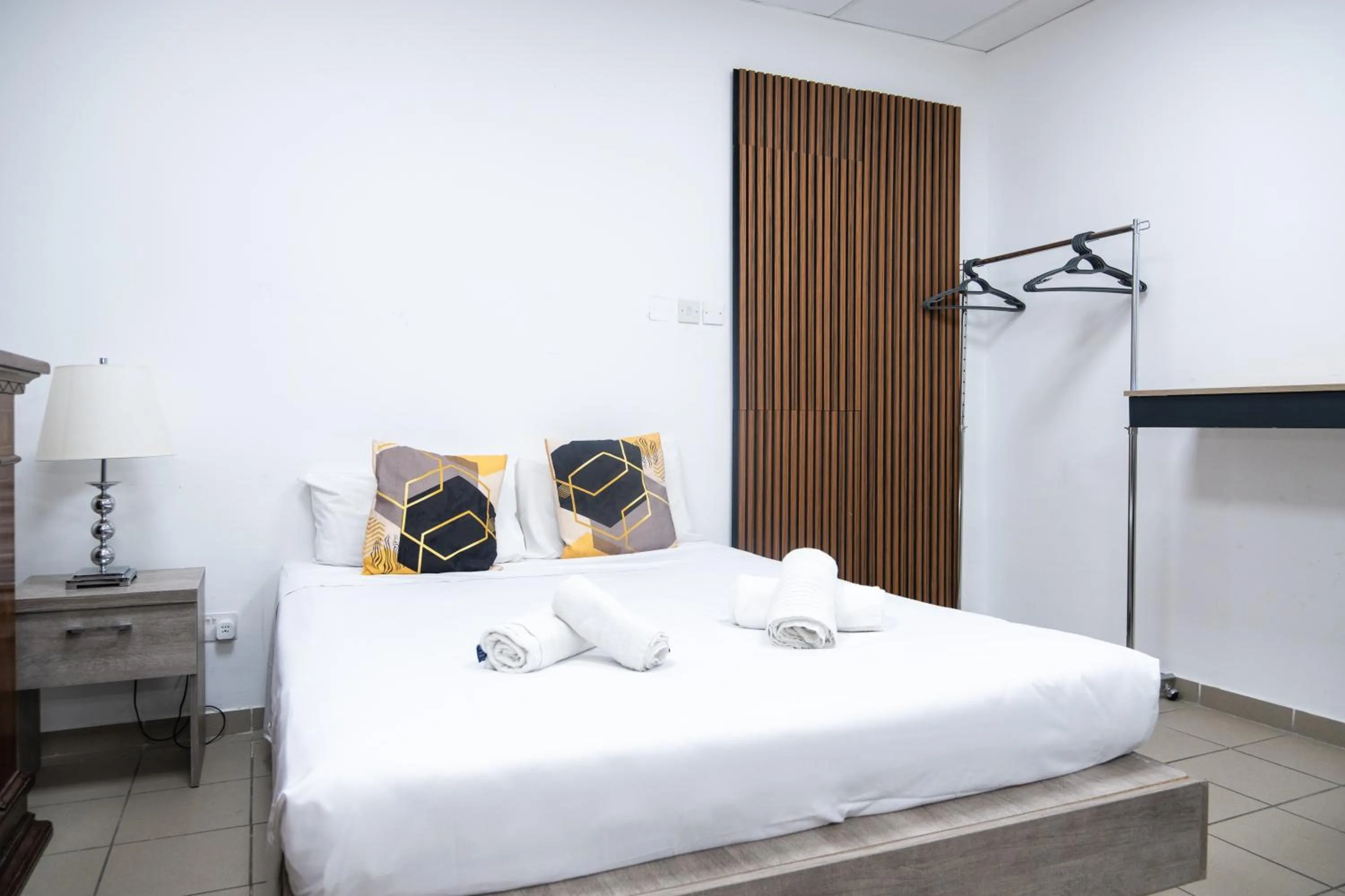 Bed in Napoli Suites Studios Aparthotel