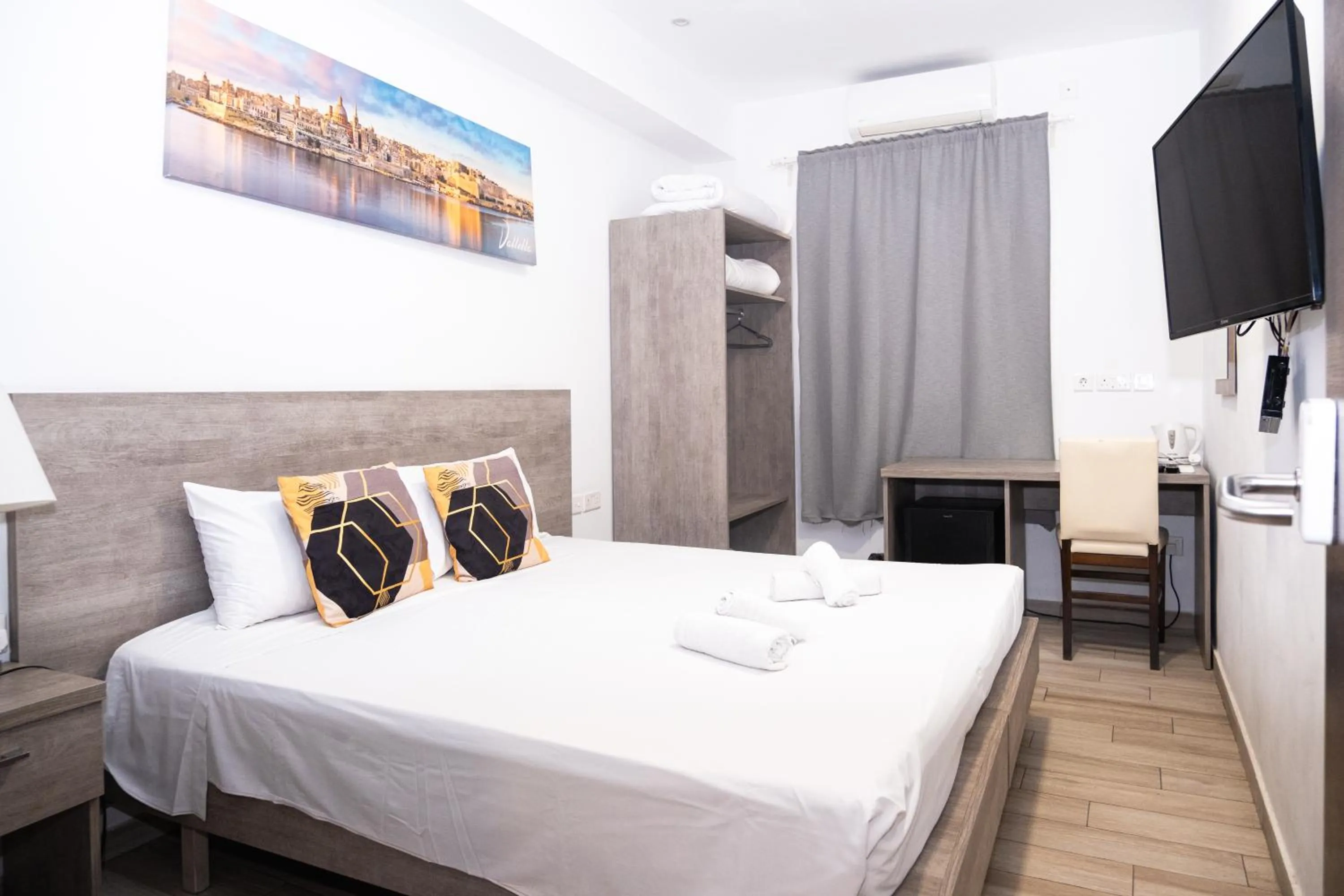 Bed in Napoli Suites Studios Aparthotel