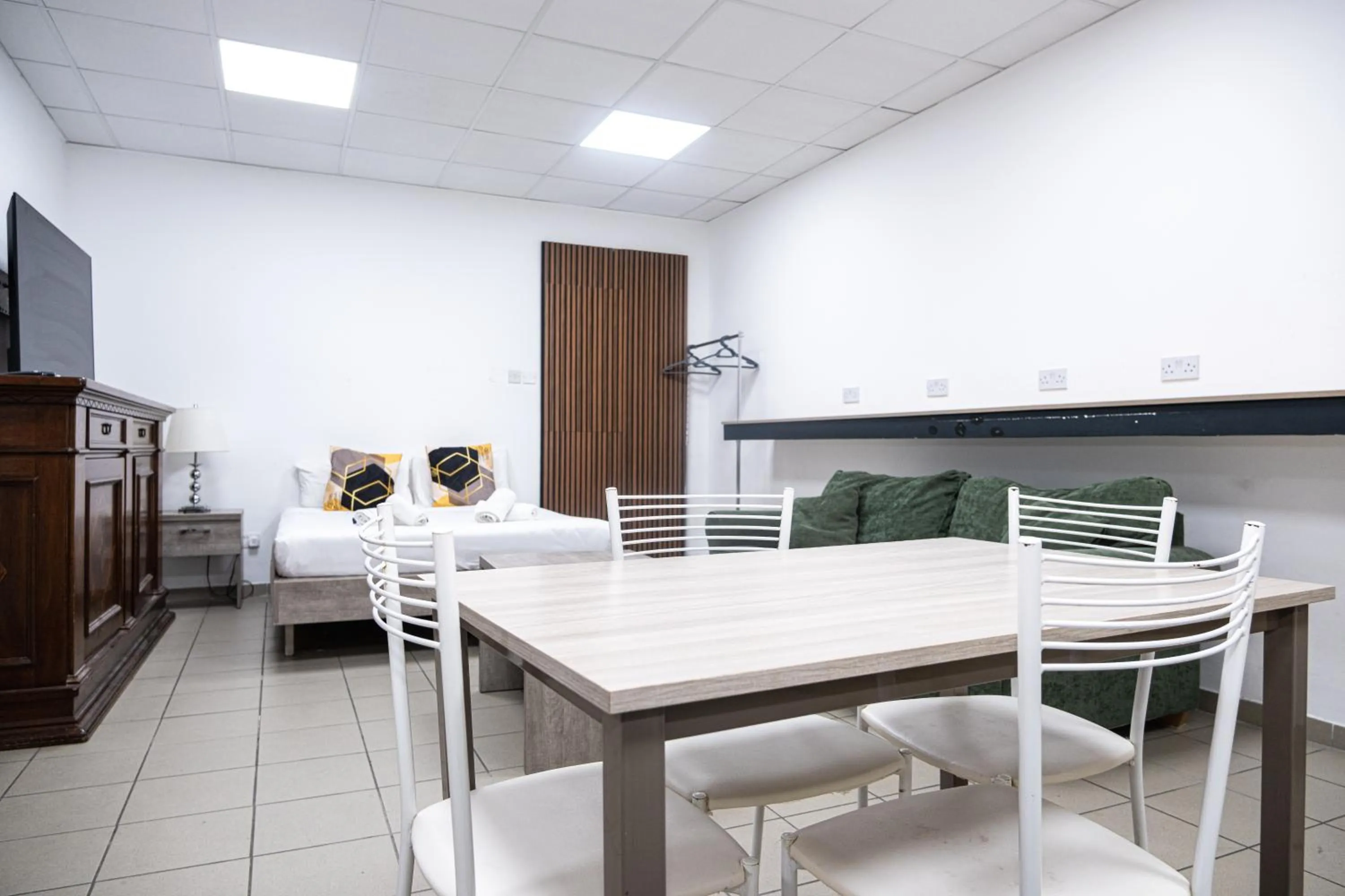 Bed in Napoli Suites Studios Aparthotel