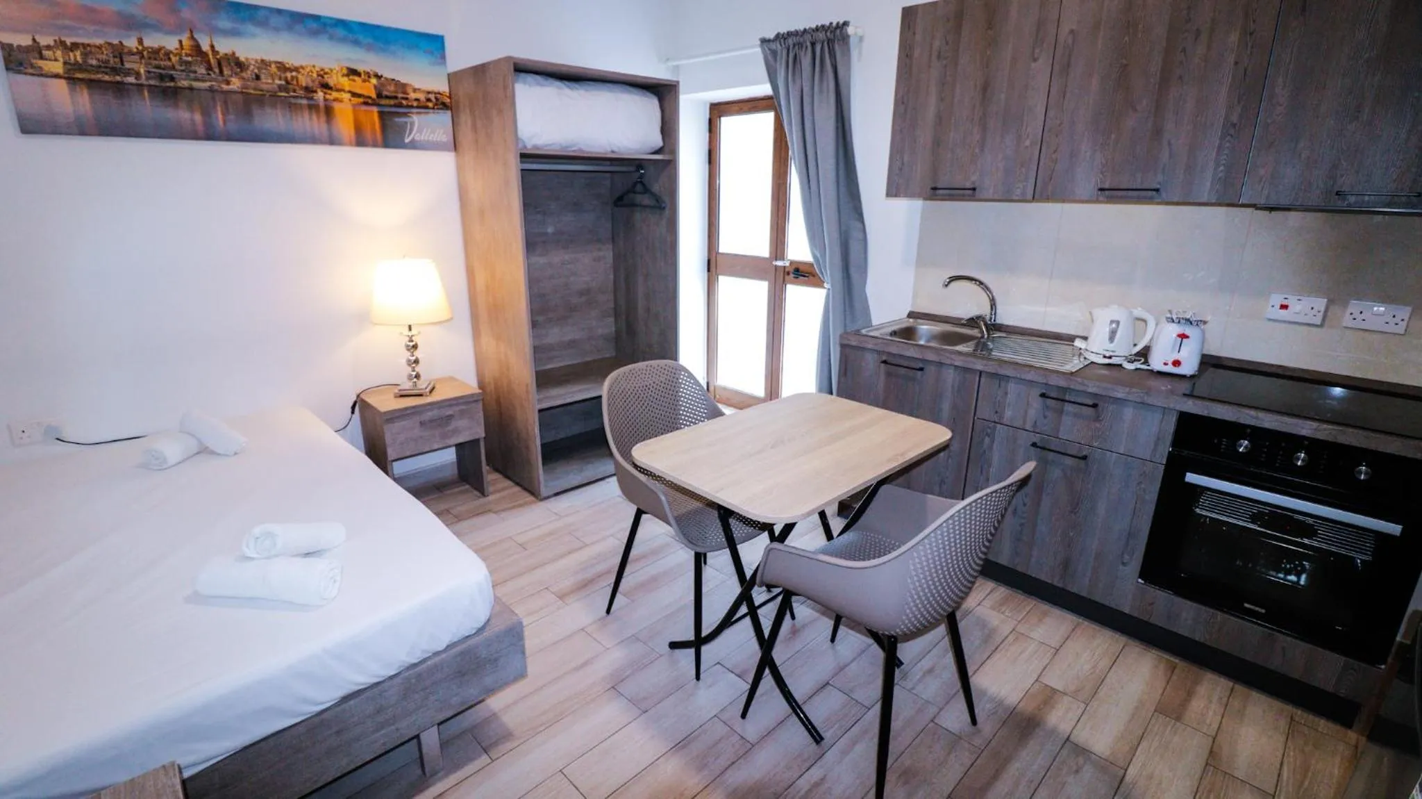 Bed in Napoli Suites Studios Aparthotel