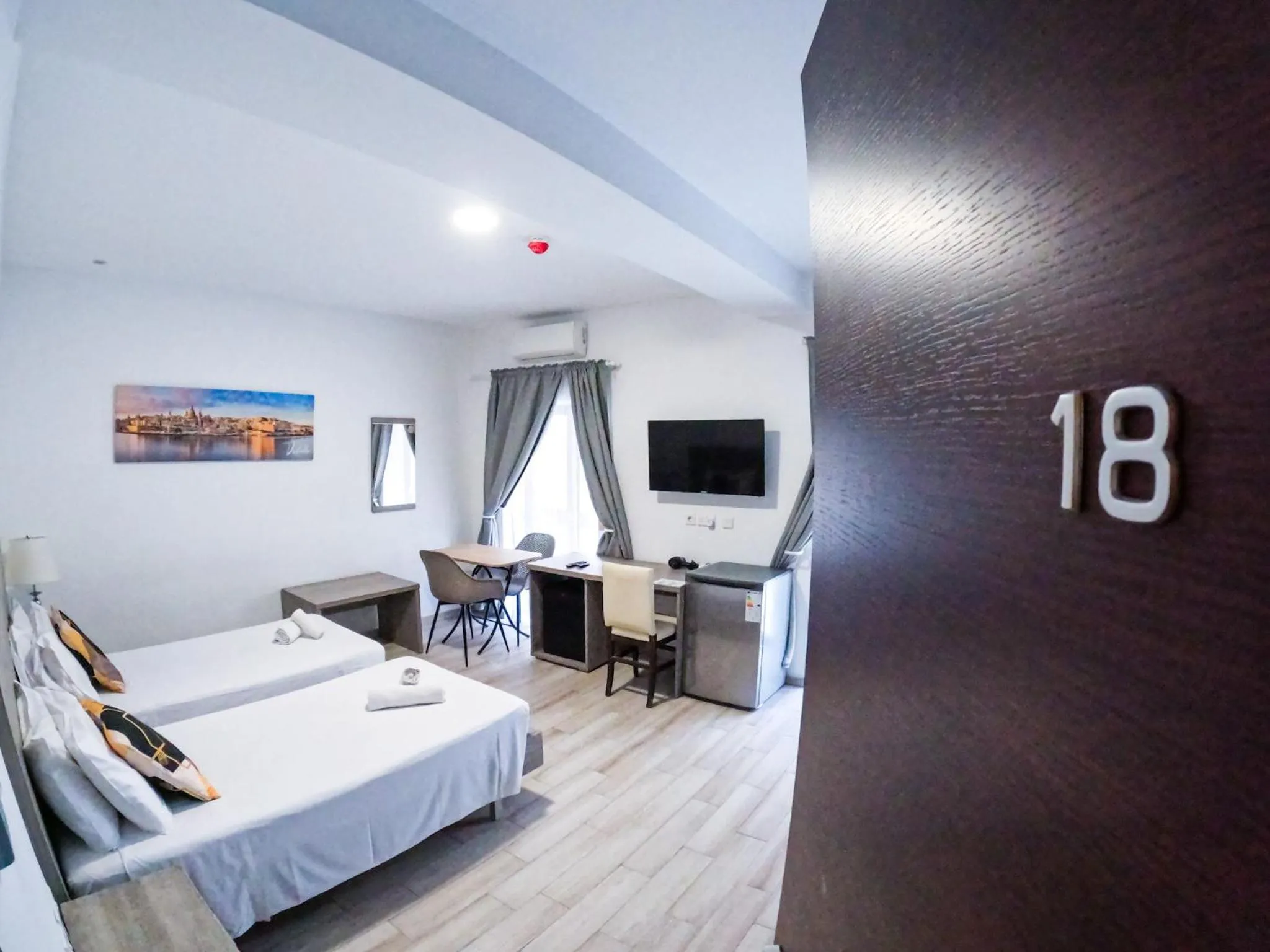 Bed in Napoli Suites Studios Aparthotel