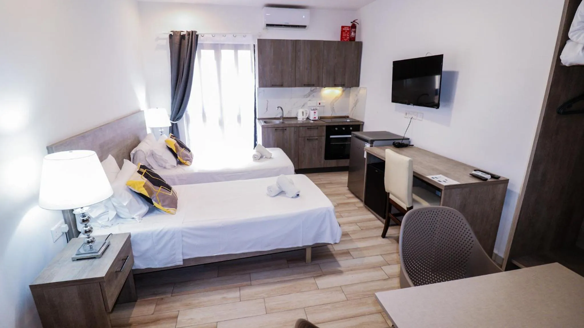 Bed in Napoli Suites Studios Aparthotel