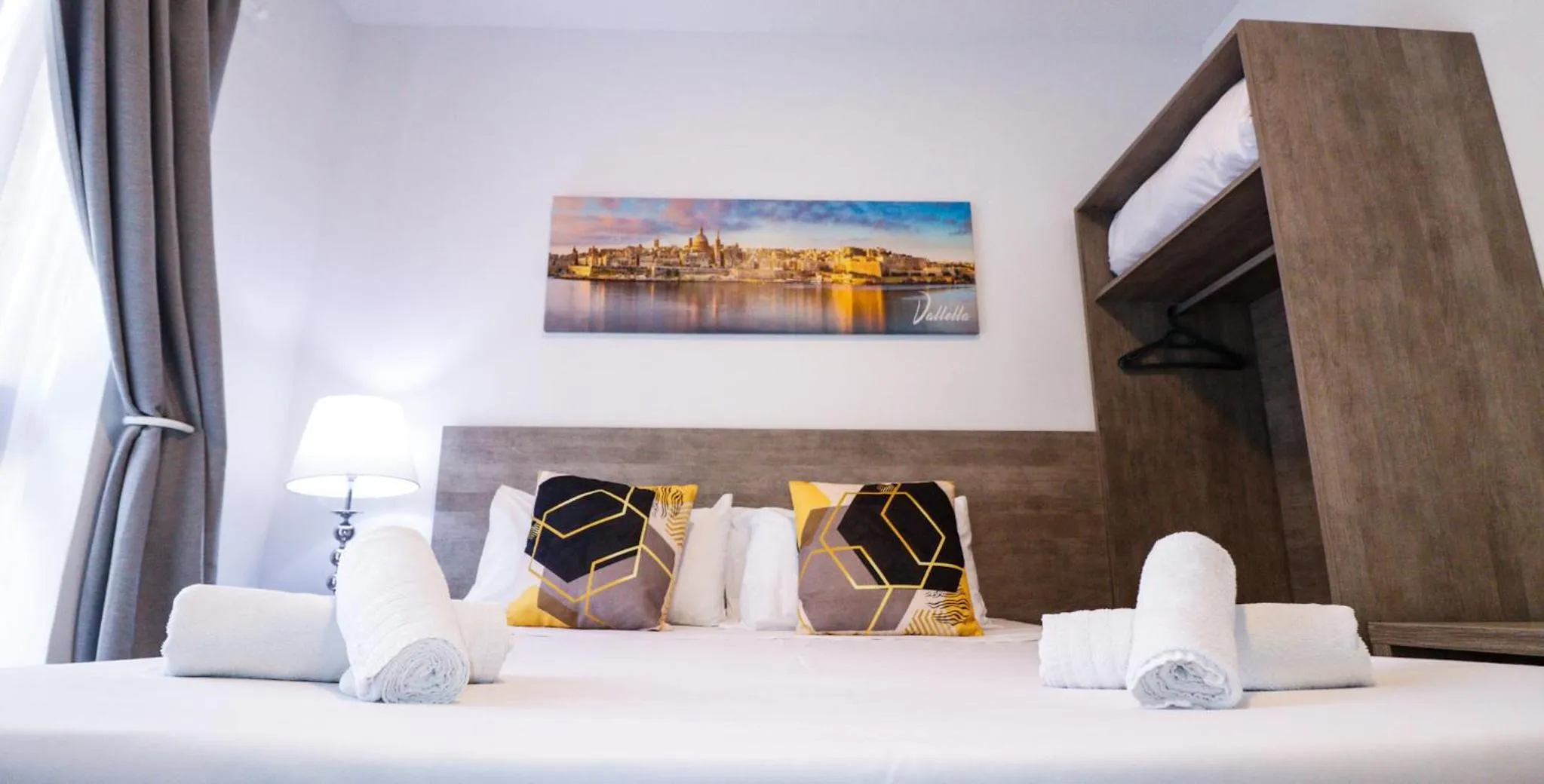 Bed in Napoli Suites Studios Aparthotel