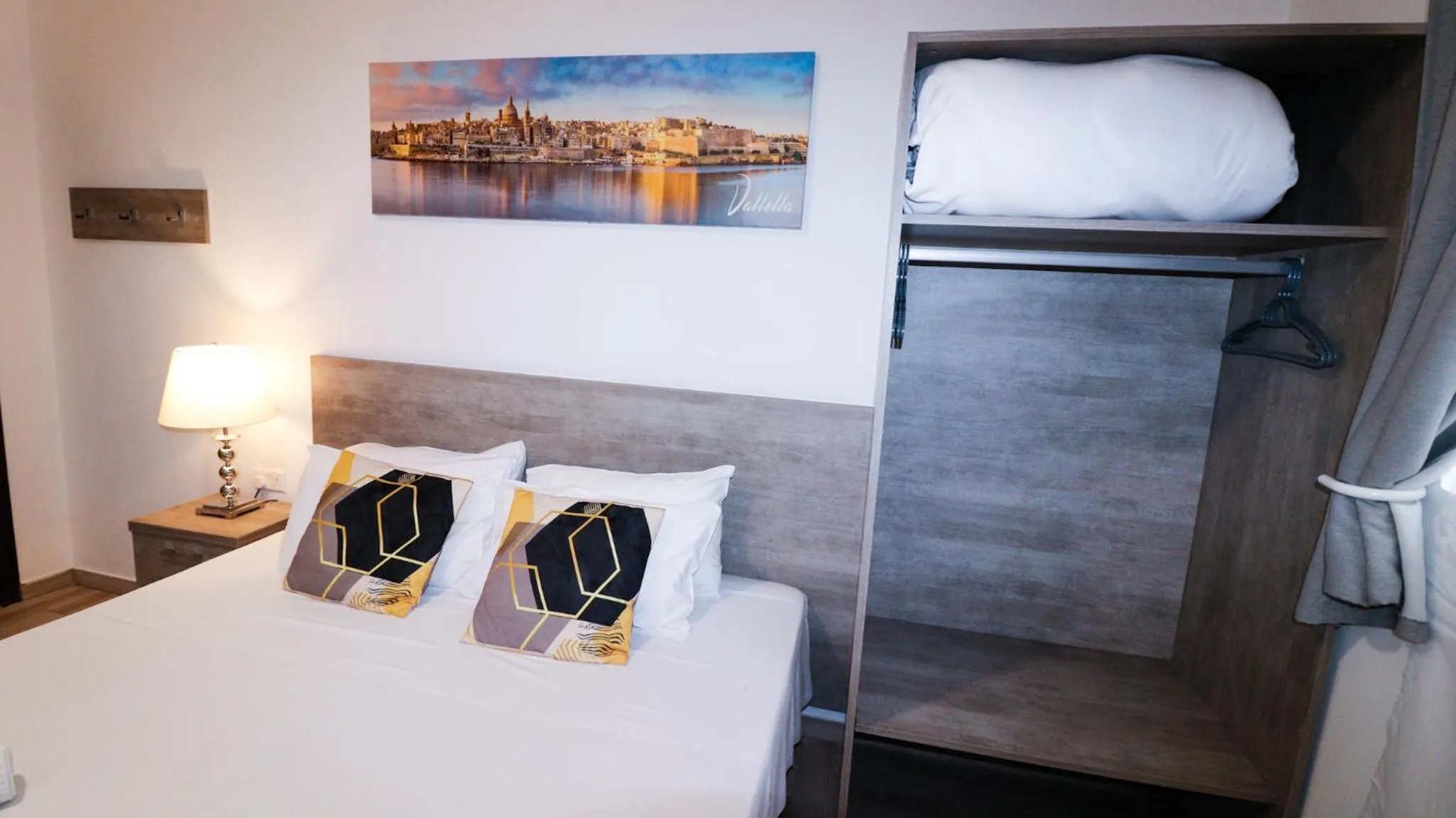 Bed in Napoli Suites Studios Aparthotel