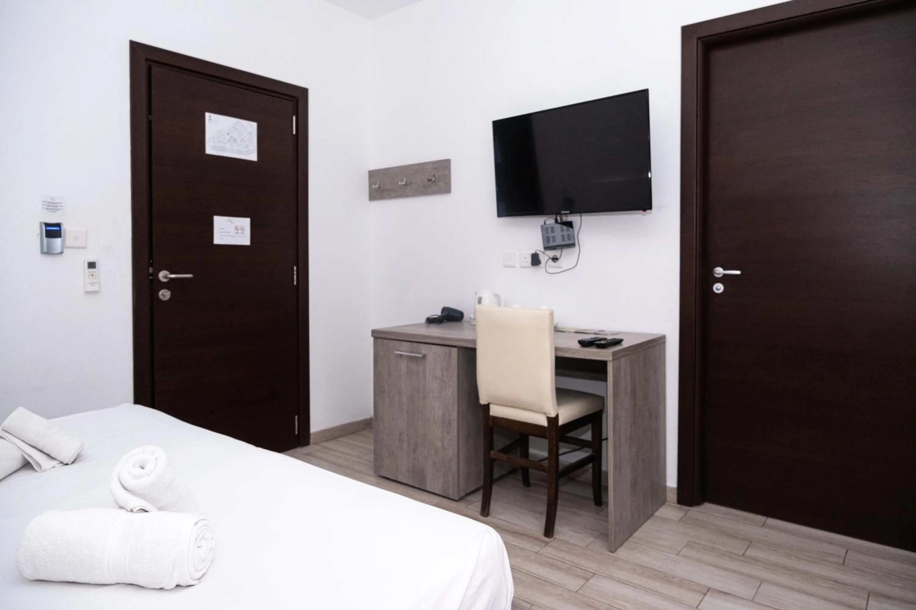 Bed in Napoli Suites Studios Aparthotel