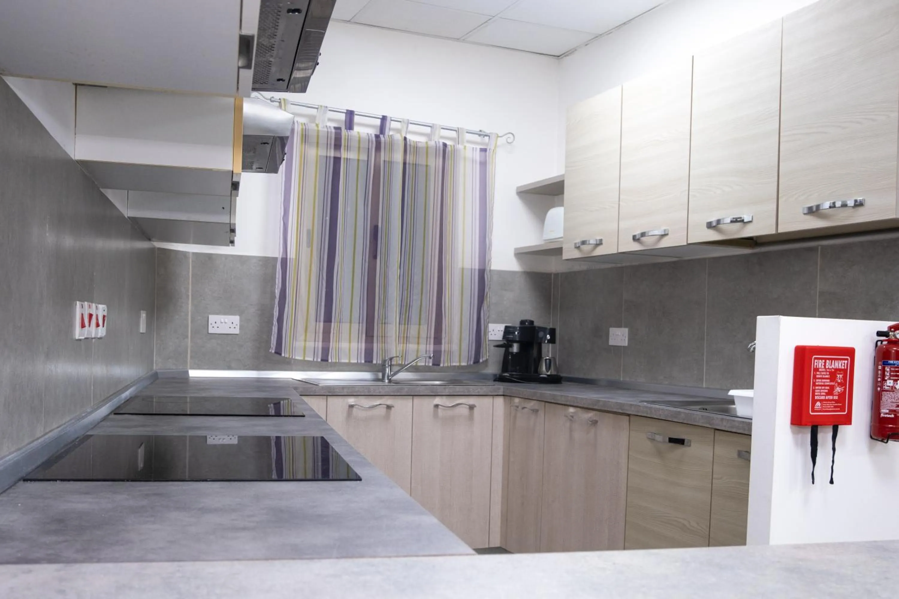 Kitchen or kitchenette in Napoli Suites Studios Aparthotel
