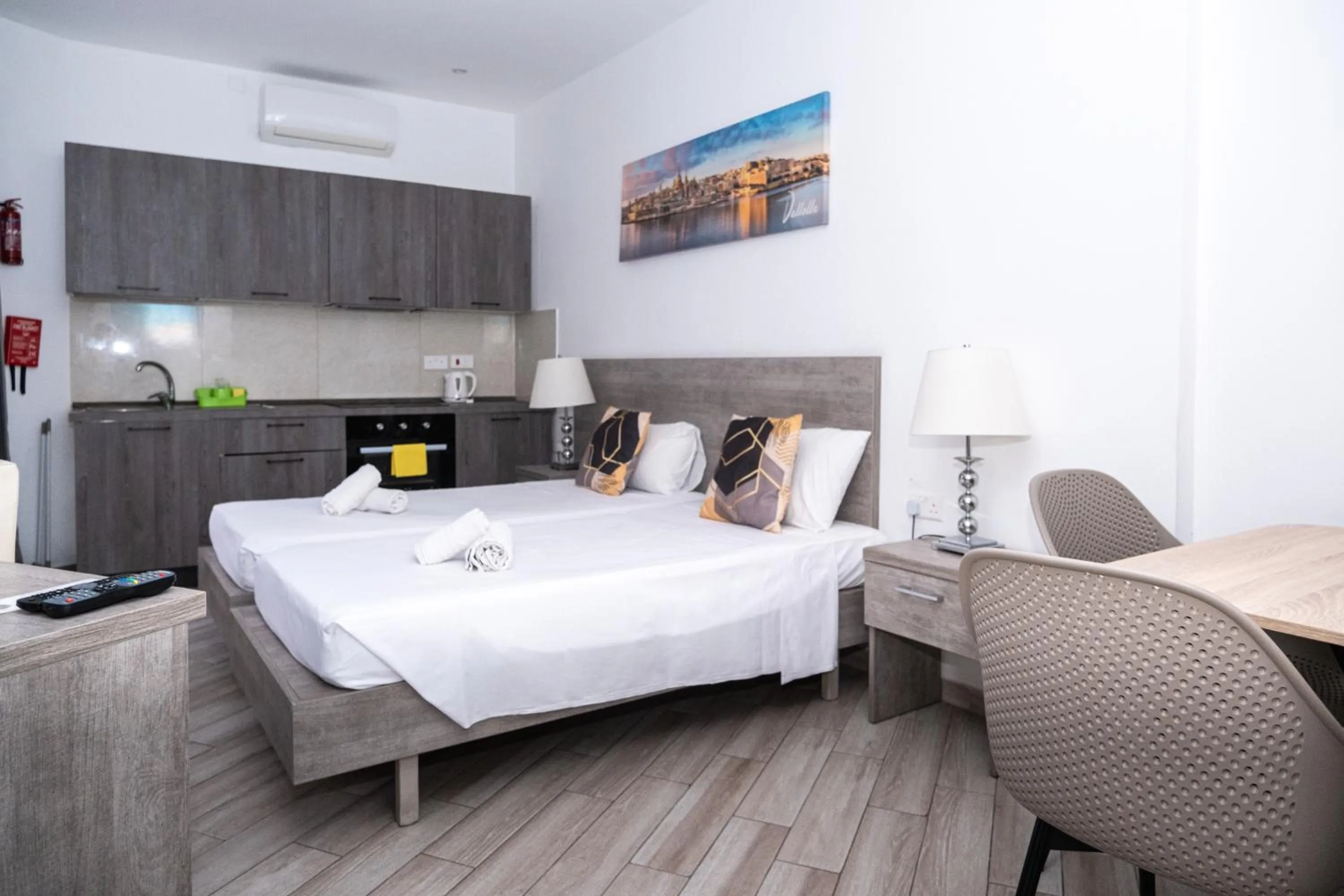 Bed in Napoli Suites Studios Aparthotel