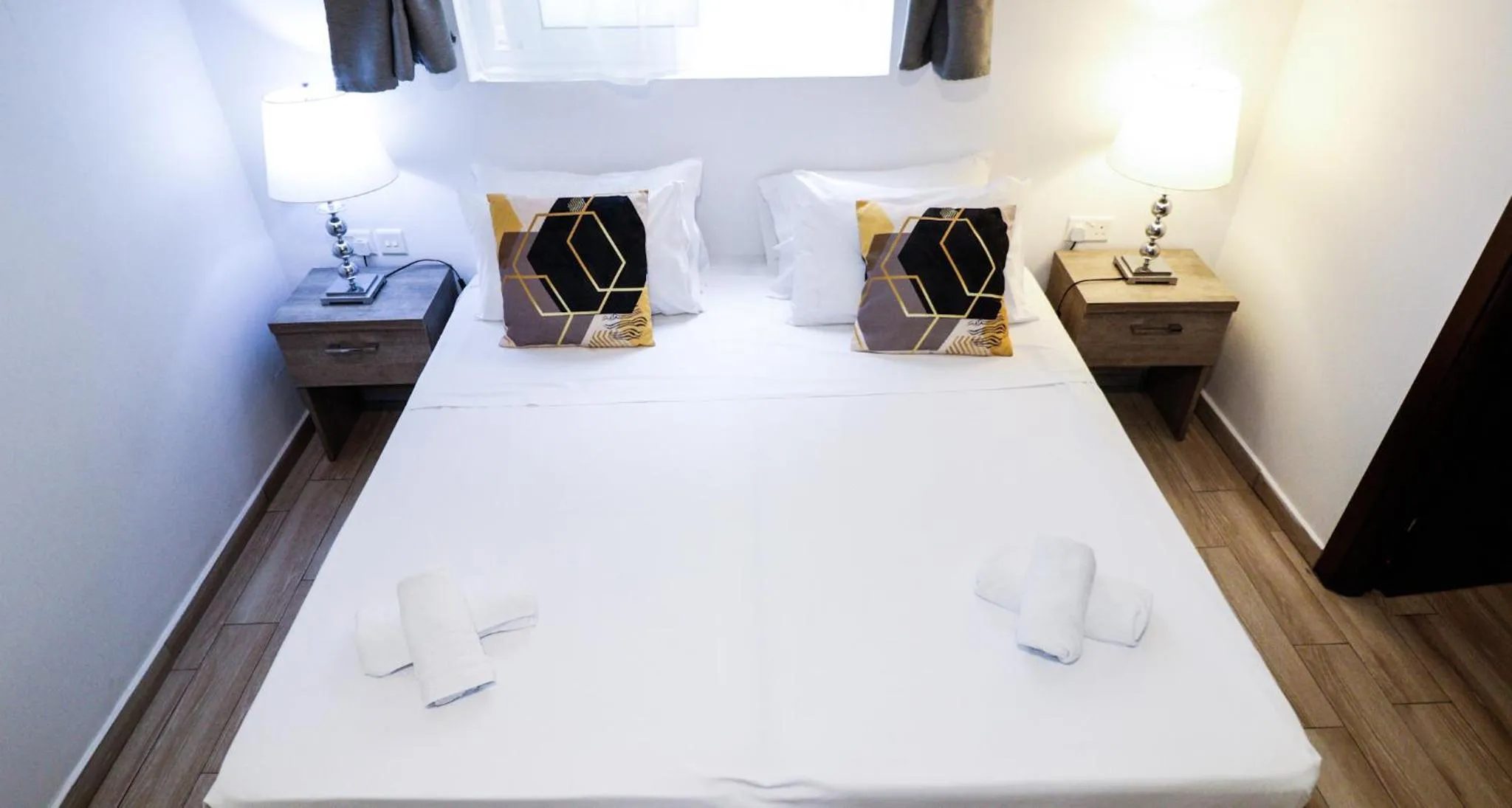 Bed in Napoli Suites Studios Aparthotel