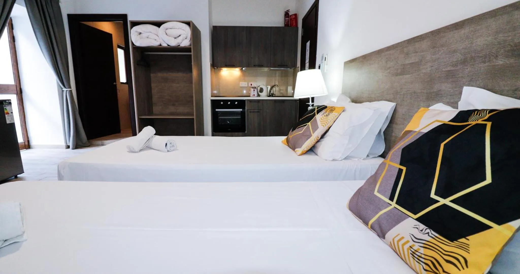 Bed in Napoli Suites Studios Aparthotel