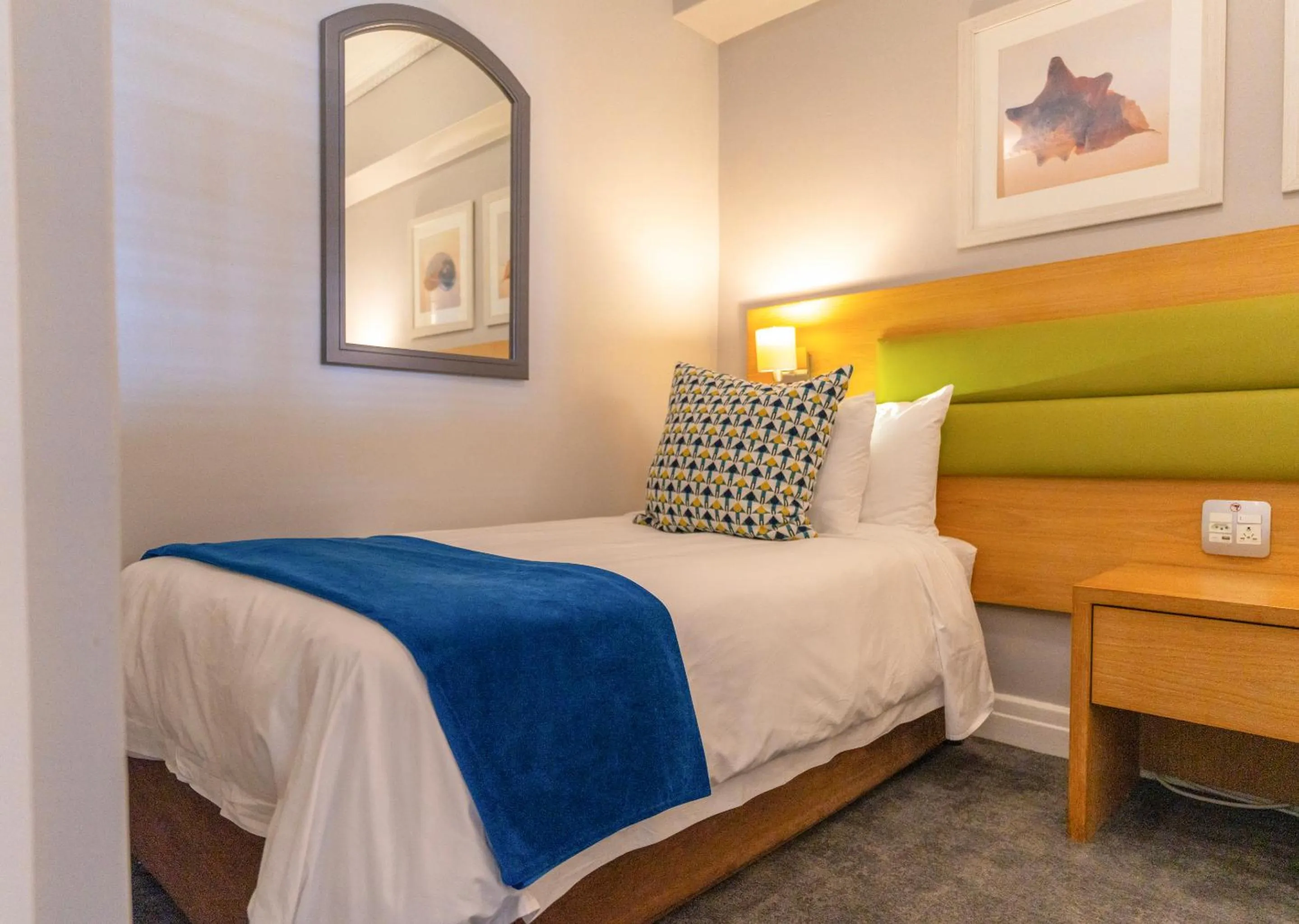 Bed in Peninsula All Suite Hotel by Dream Resorts