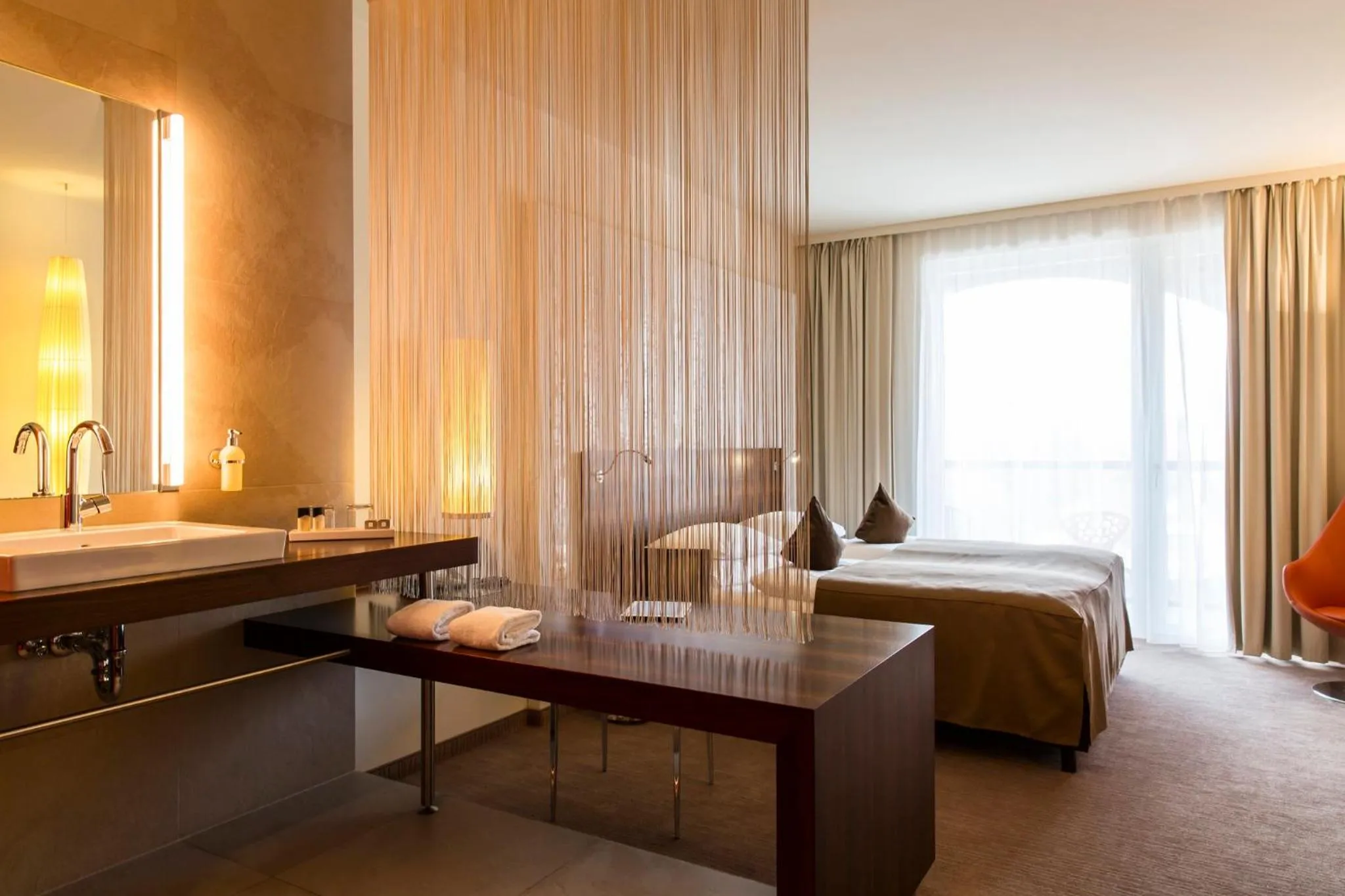 Photo of the whole room, Bed in Das Seepark Wörthersee Resort