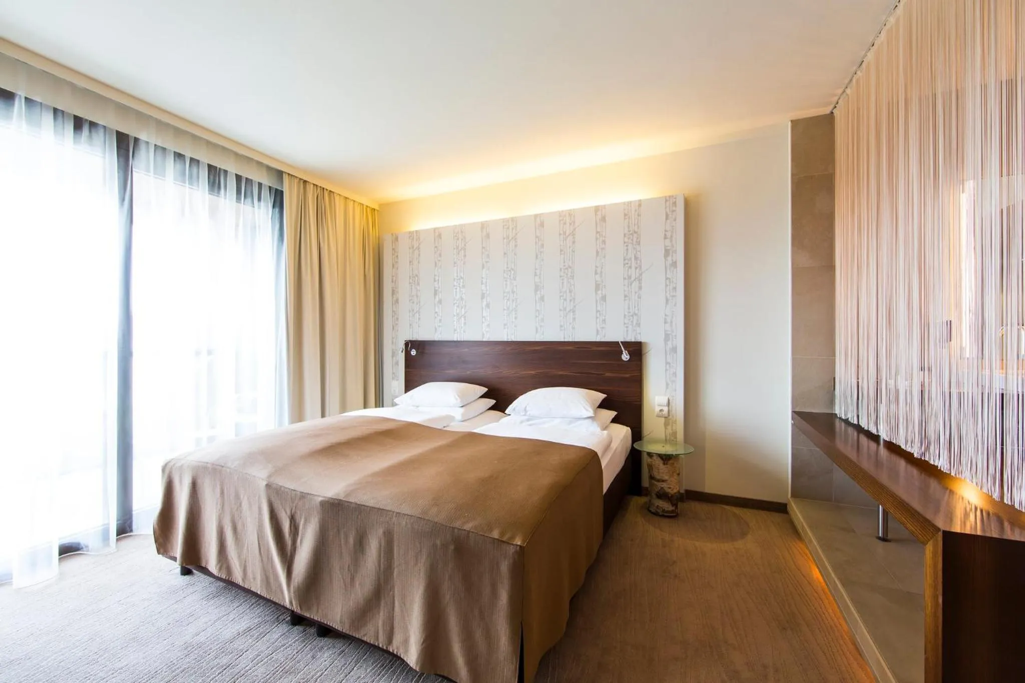 Photo of the whole room, Bed in Das Seepark Wörthersee Resort