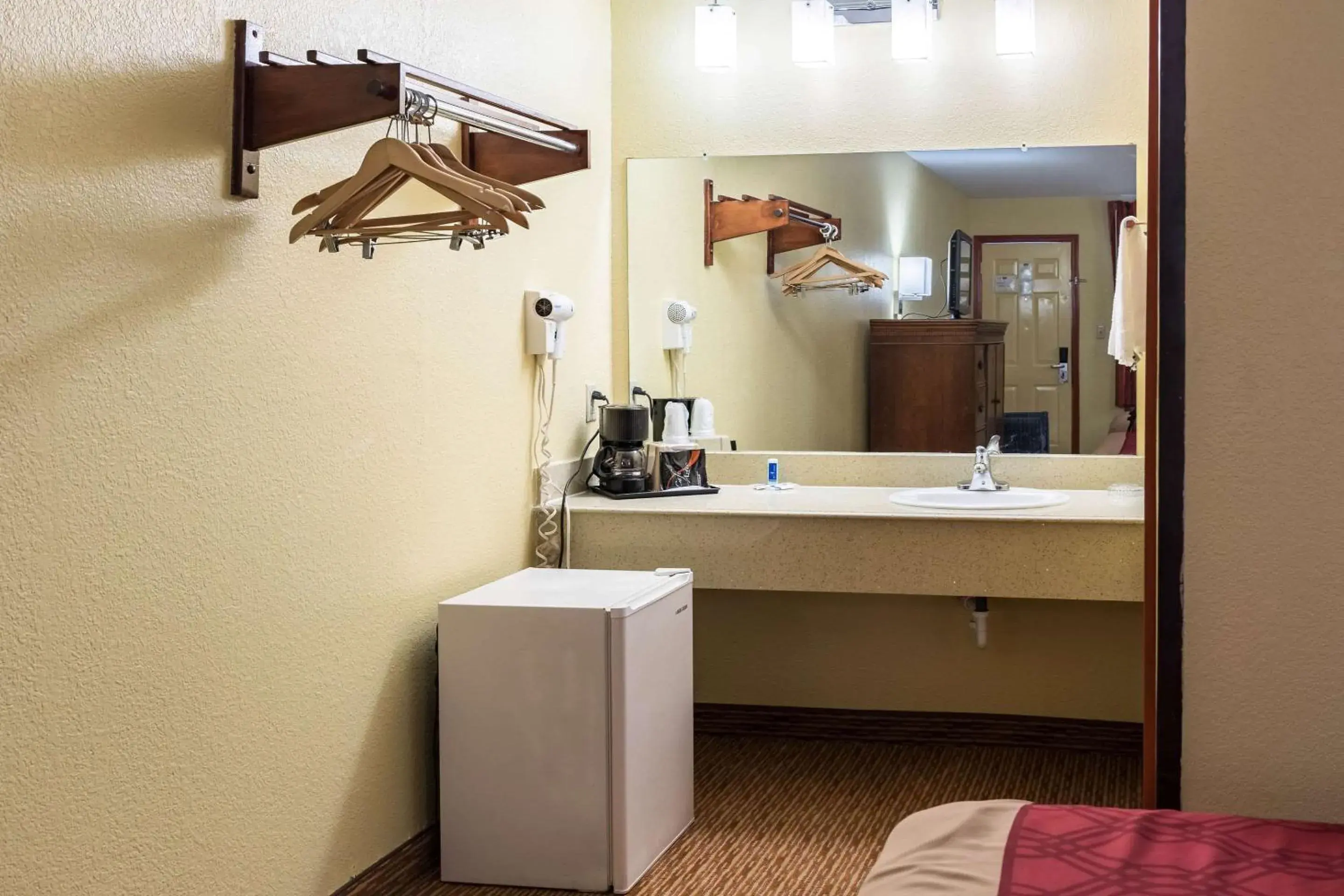 Photo of the whole room, TV/Entertainment Center in Rodeway Inn - Galveston