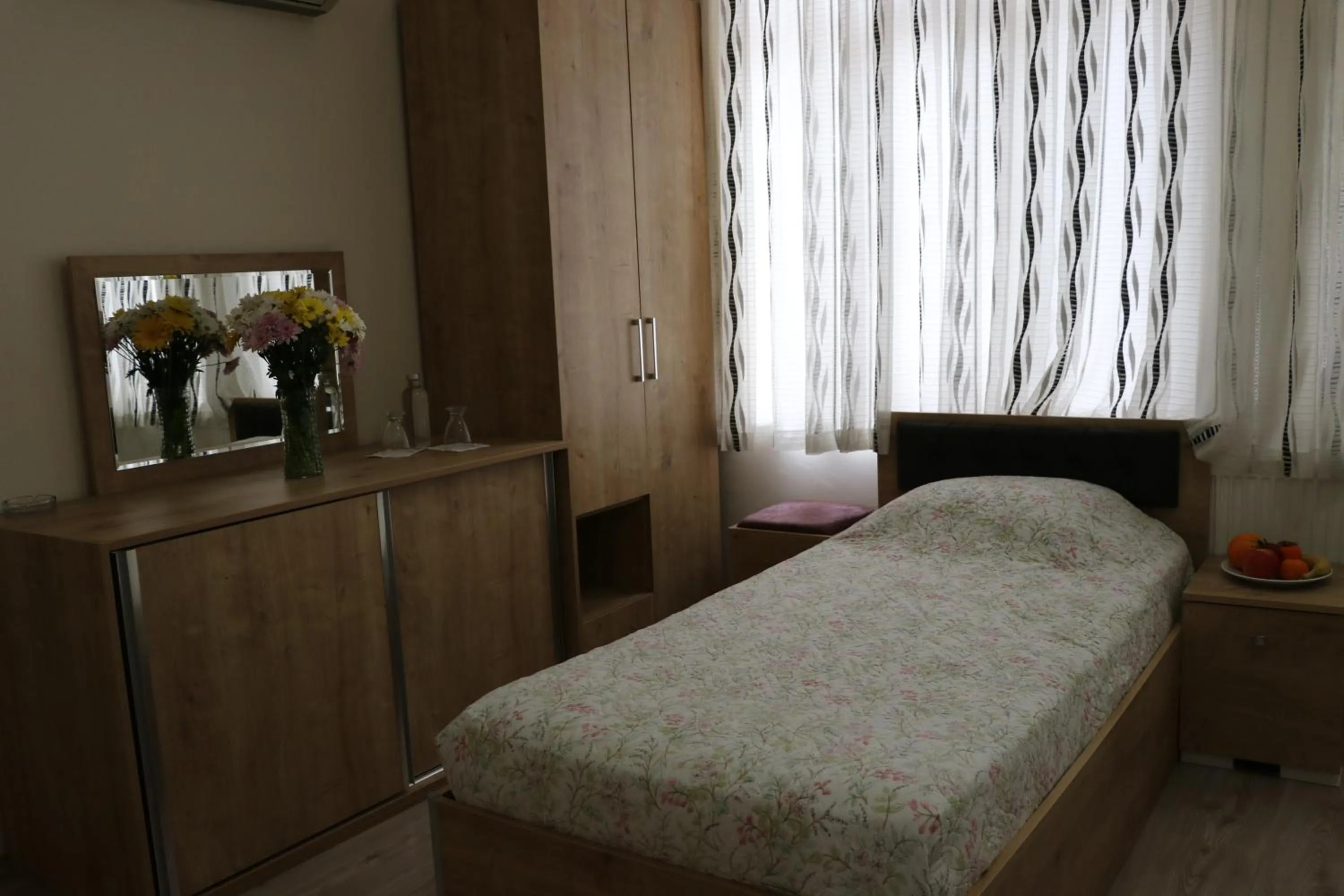 Bed in Golden Apple Hotel