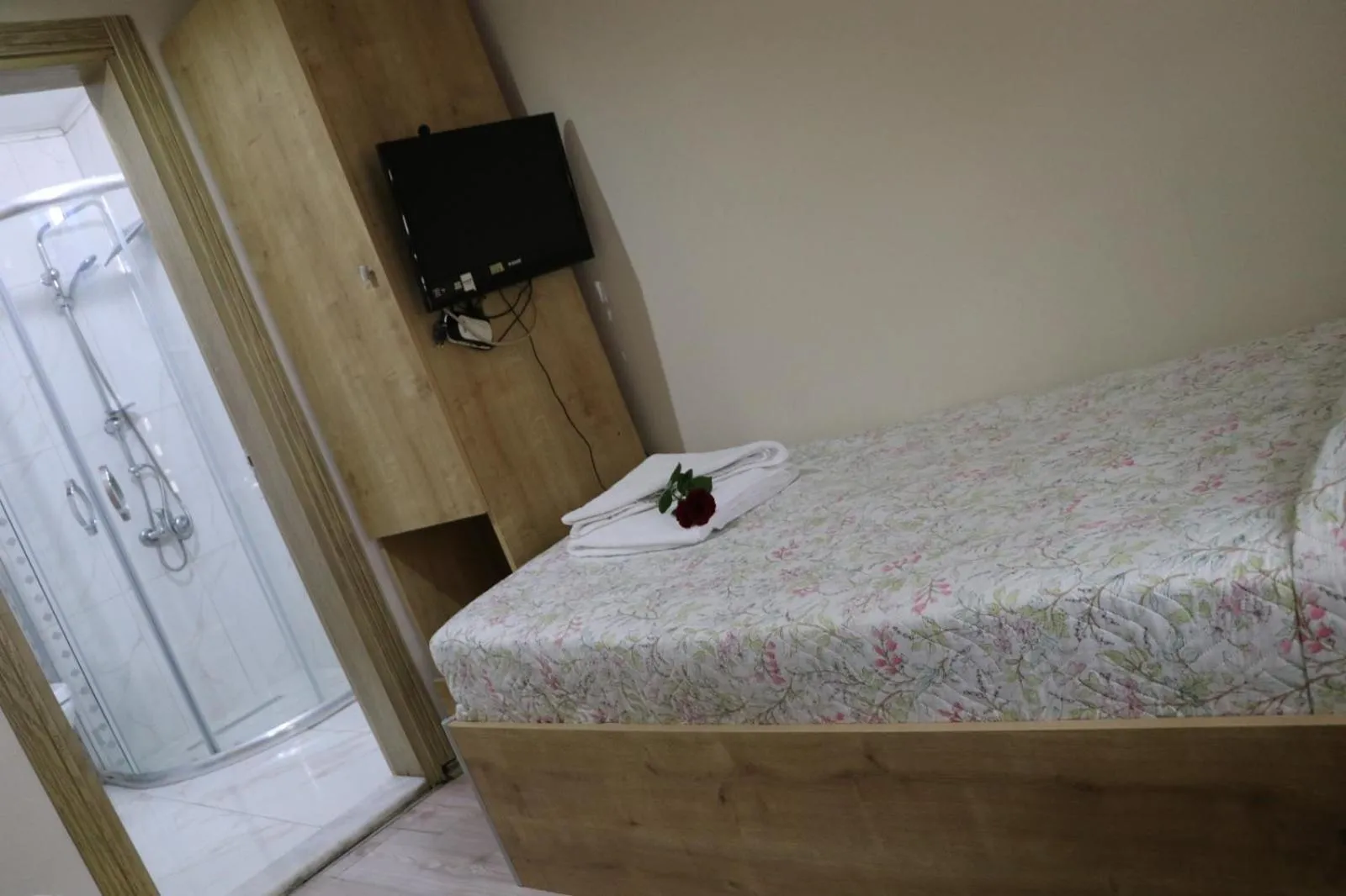 Bed in Golden Apple Hotel