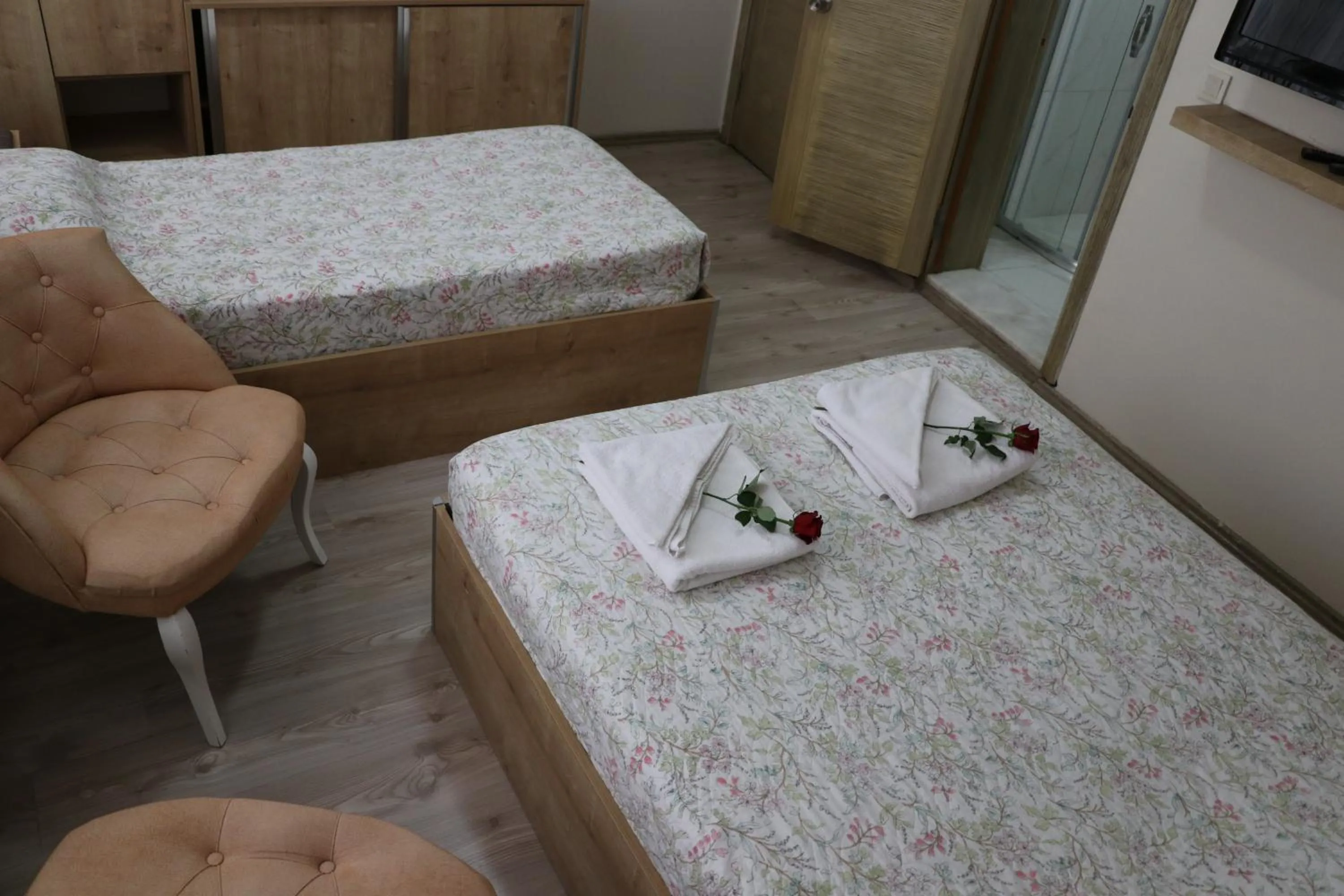 Bed in Golden Apple Hotel
