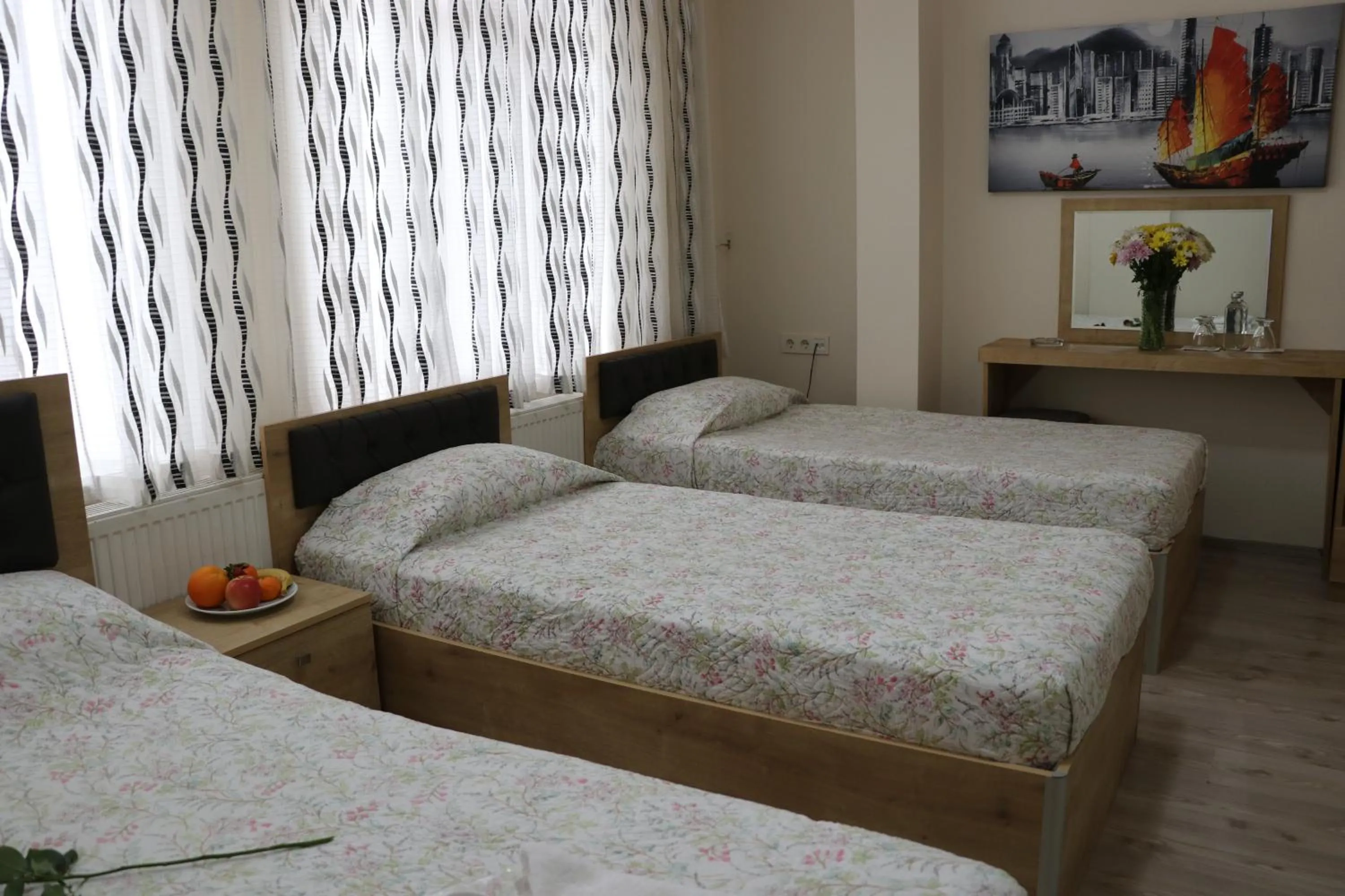 Bed in Golden Apple Hotel
