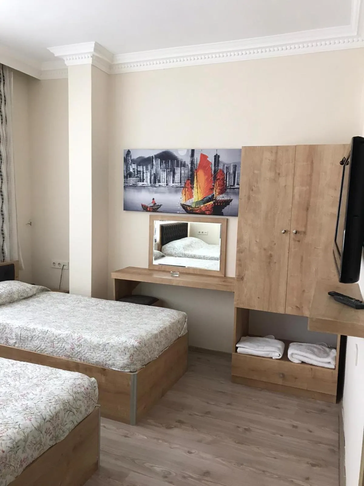 Bed in Golden Apple Hotel