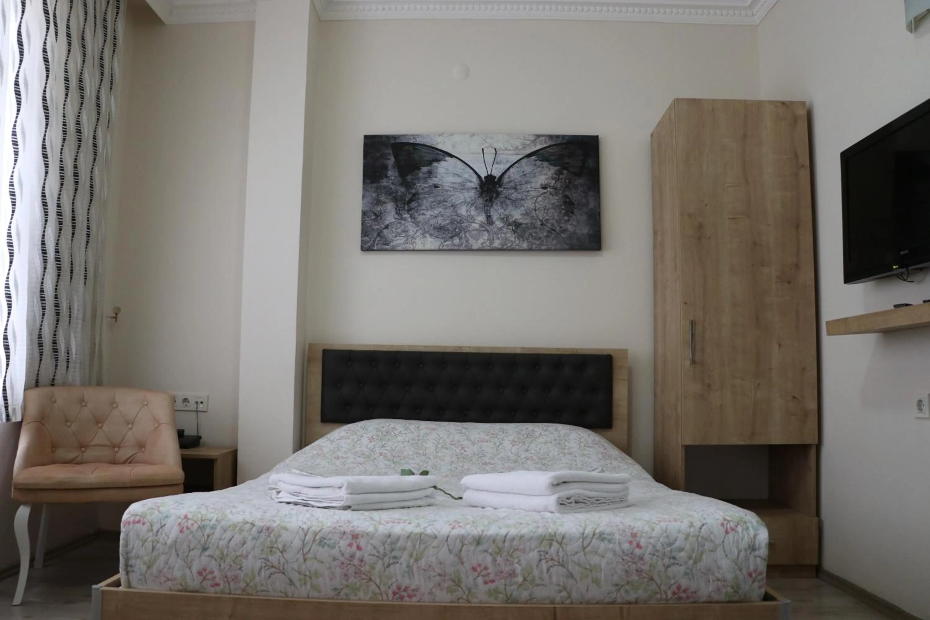 Bed in Golden Apple Hotel